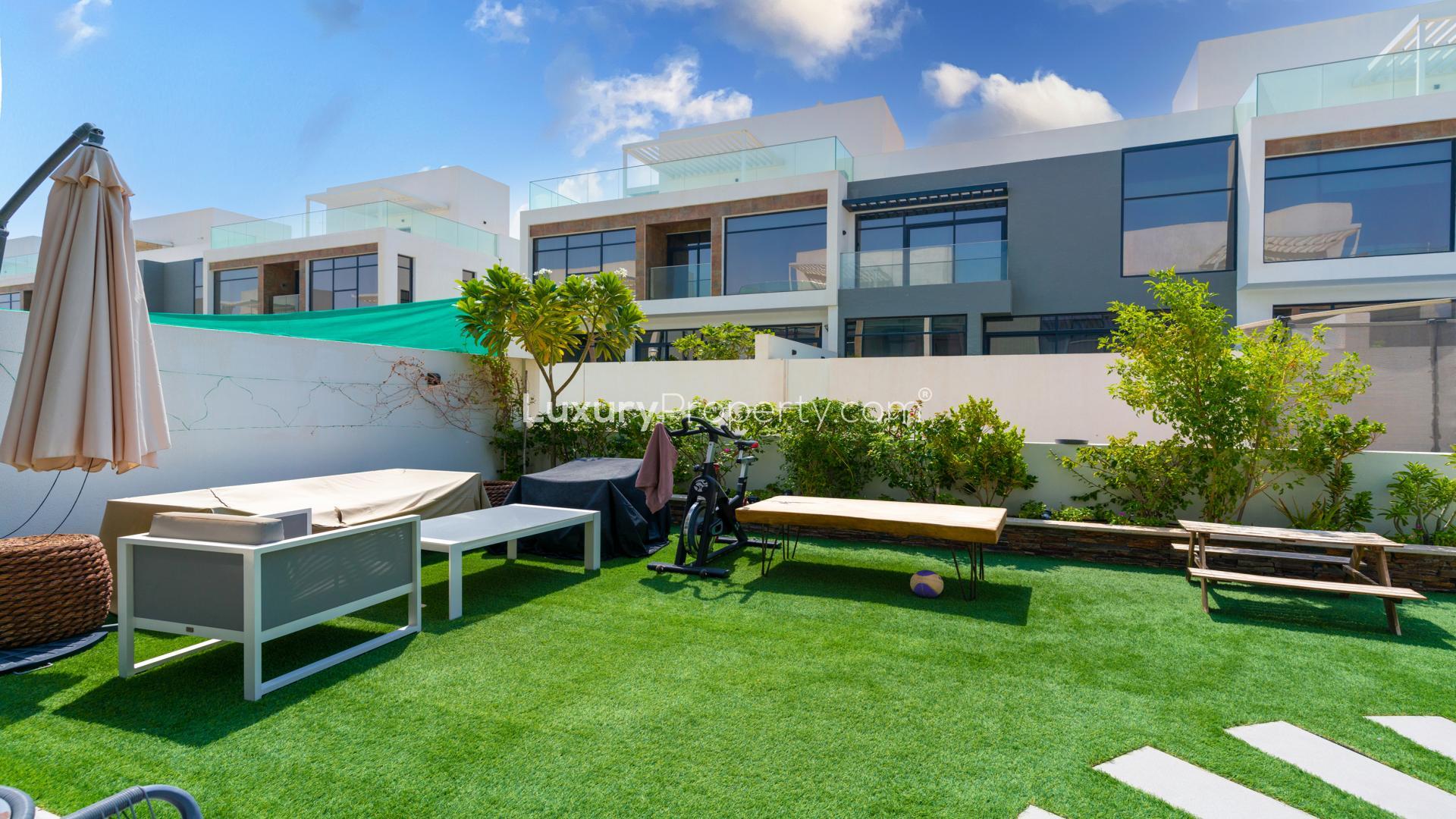 Modern kitchen in upgraded smart home villa, Jumeirah Golf Estates, featuring sleek white cabinets
