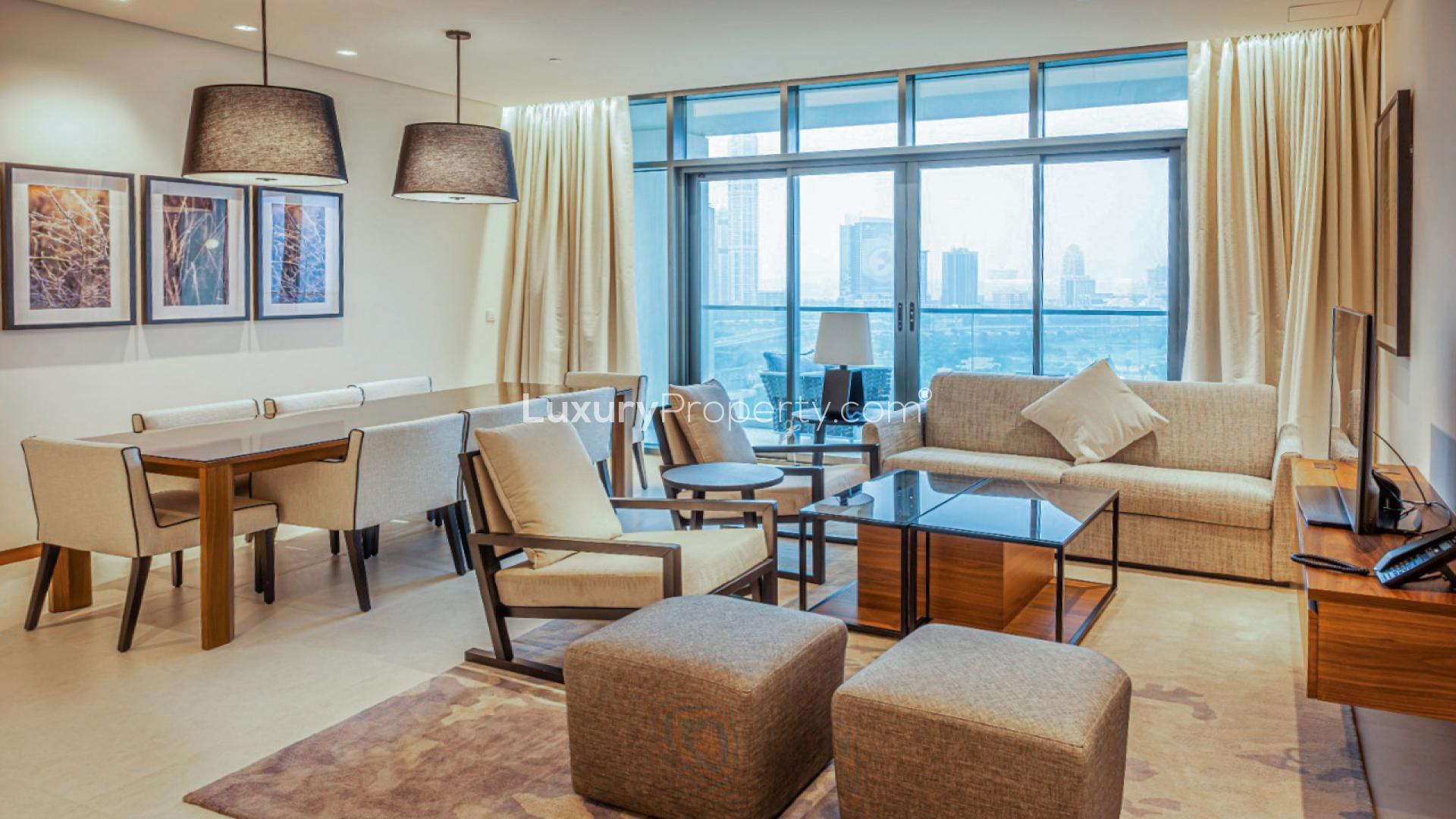 Modern living room with golf views in Vida Residence, The Hills apartment for rent