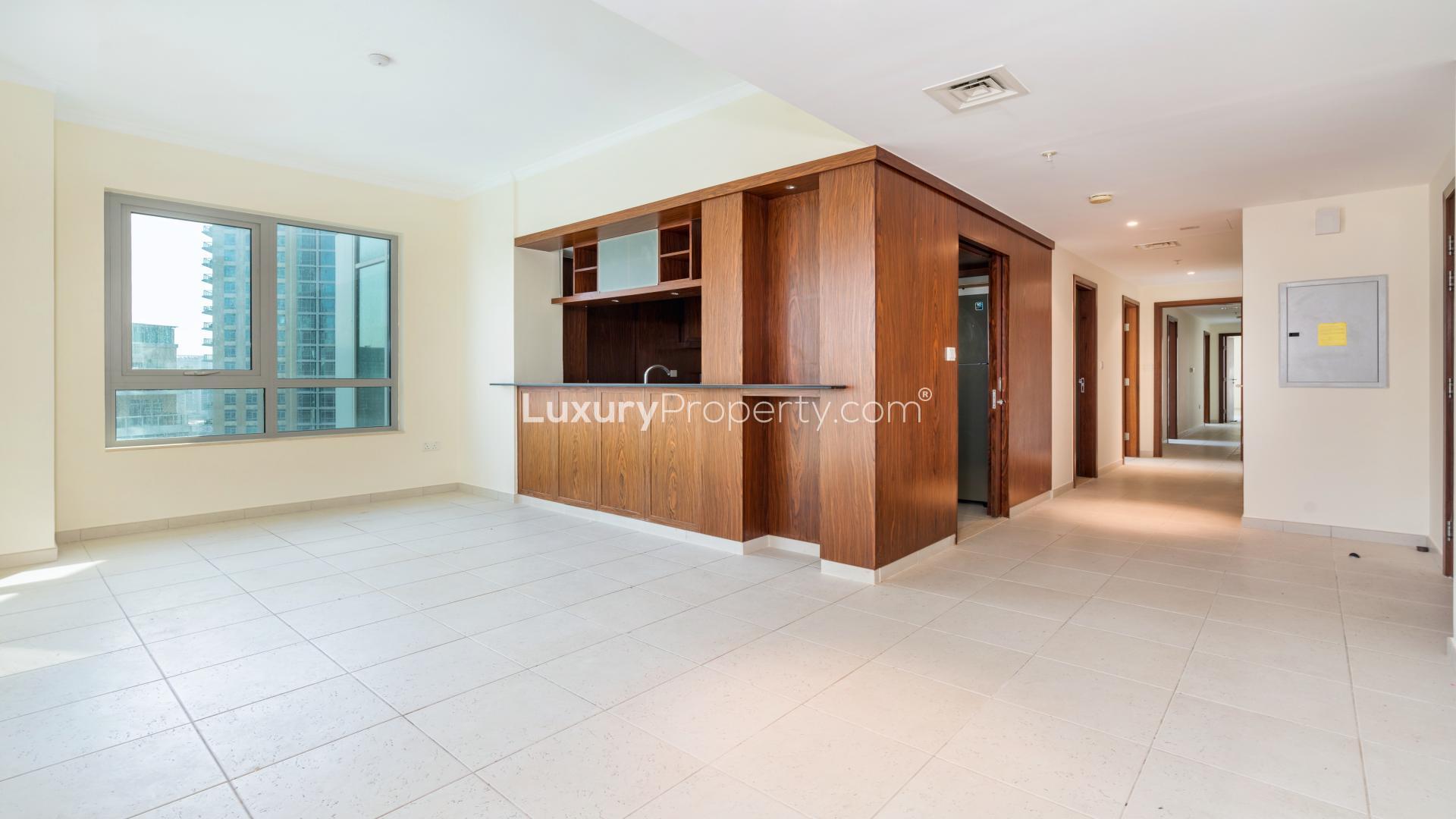 Empty apartment room with large windows, Burj Khalifa and Fountain views, Downtown Dubai