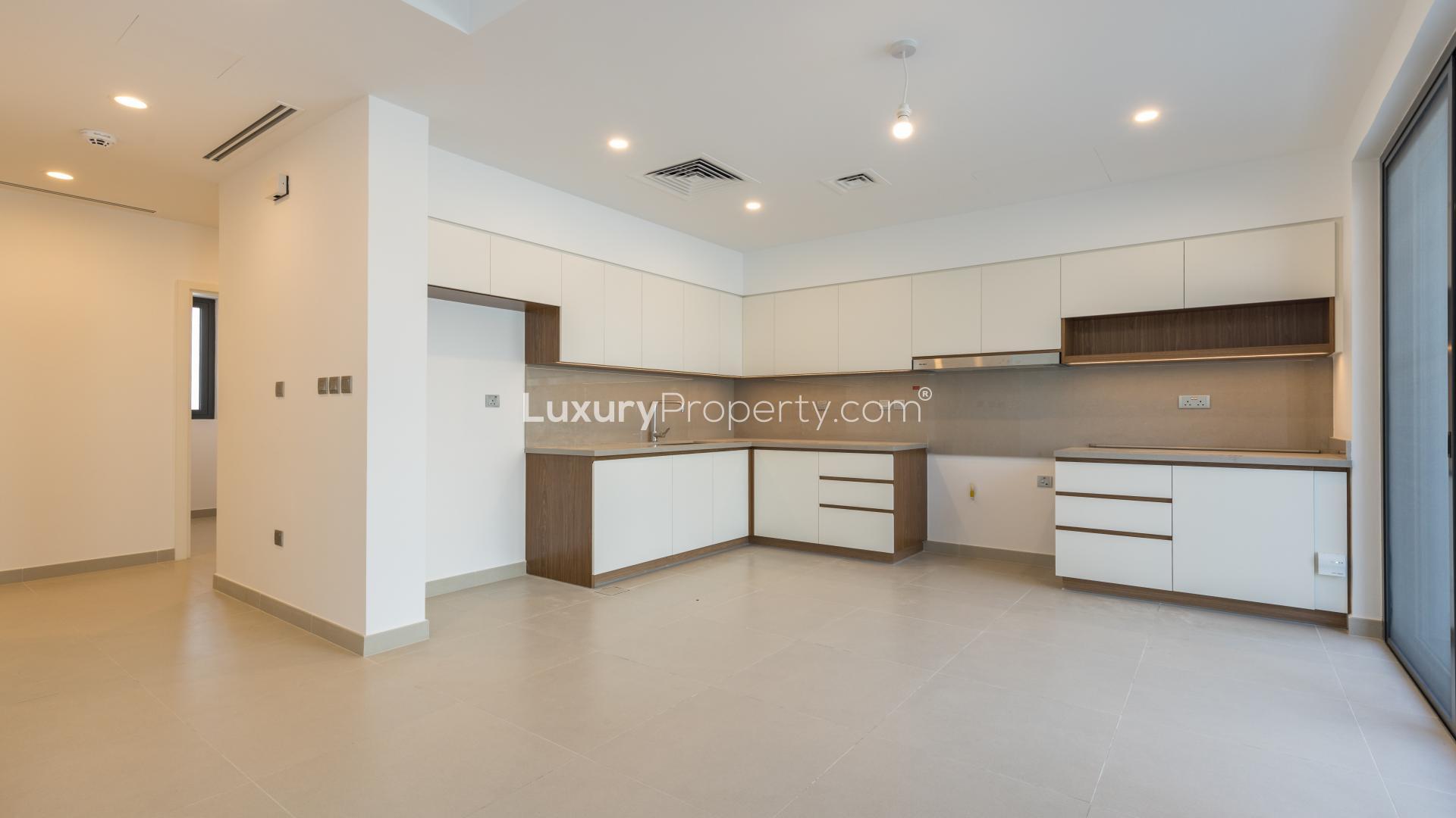 Modern living room with large windows in Camelia townhouse, Arabian Ranches 2