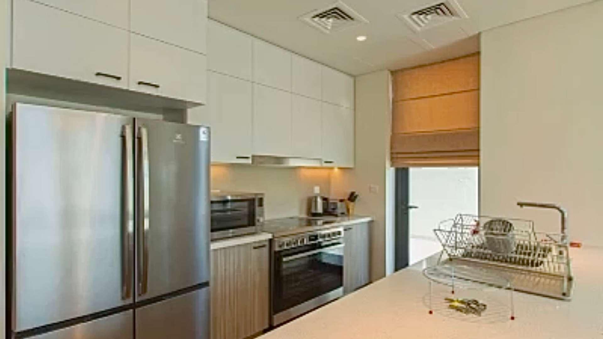Modern kitchen and living area in 3-bed villa, Club Villas, Dubai Hills Estate