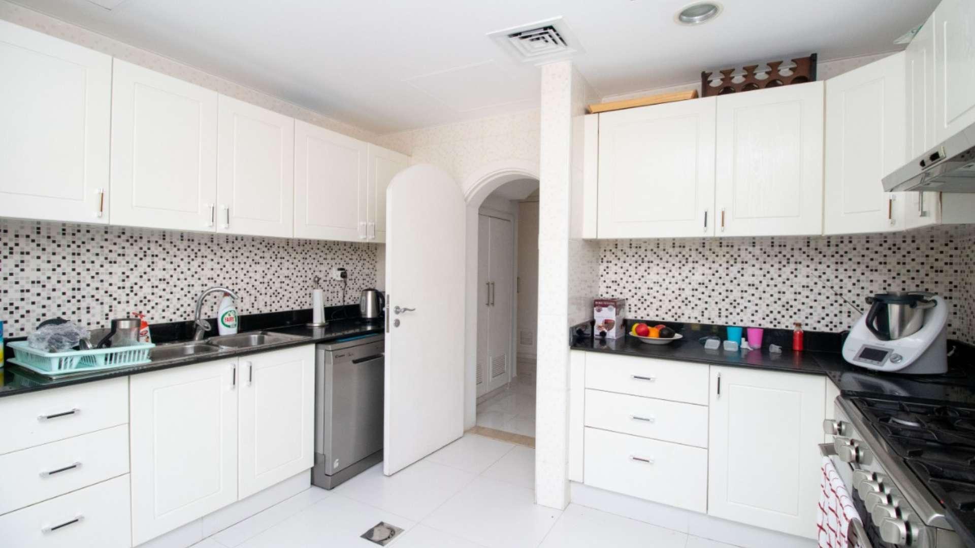 Modern kitchen in Springs 12 villa, featuring sleek appliances and ample natural light