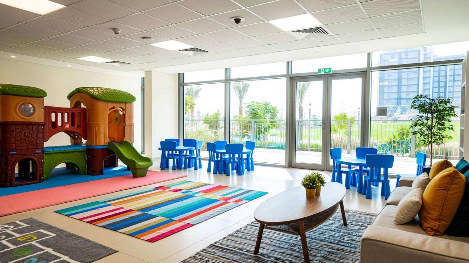 Open-plan kitchen and living area in 2-bedroom apartment, Dubai Hills Estate