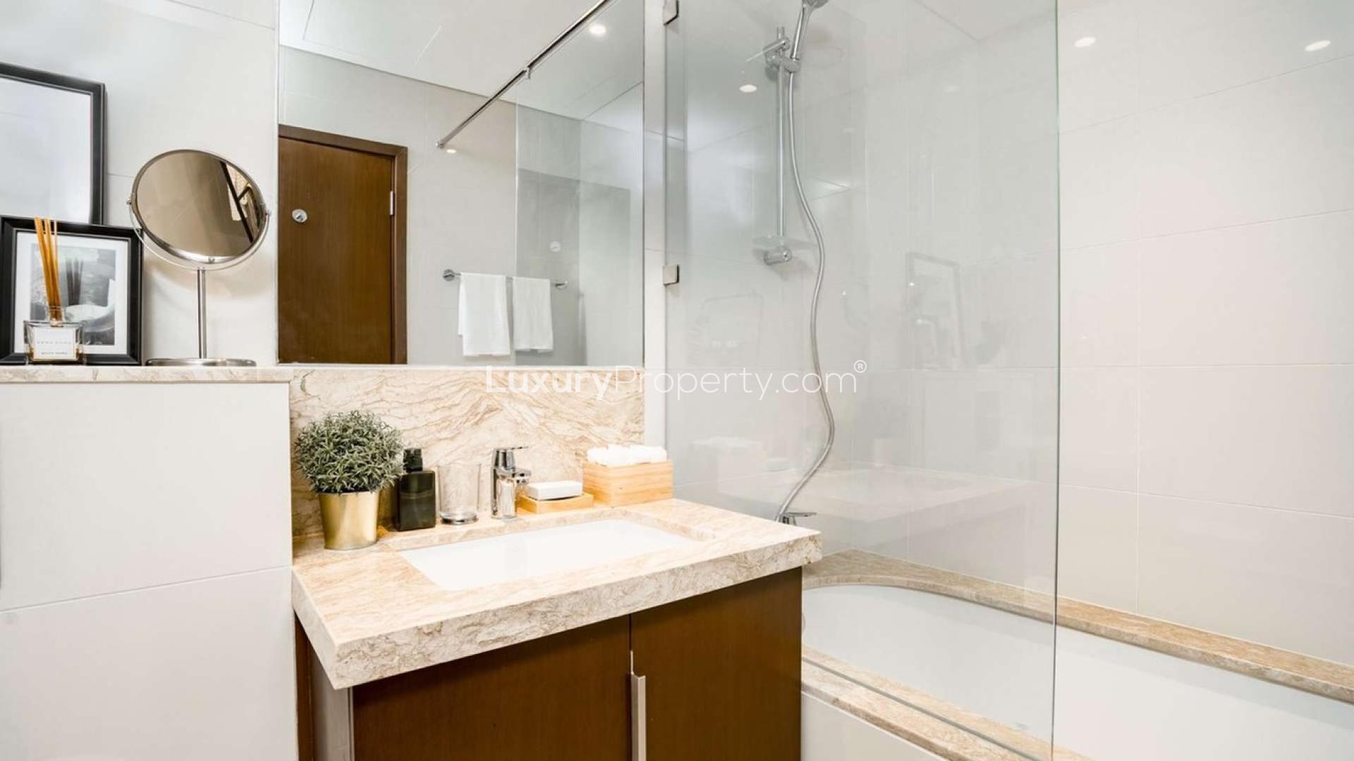 Stylish living room in Mulberry apartment, Dubai Hills Estate, with modern decor and large windows