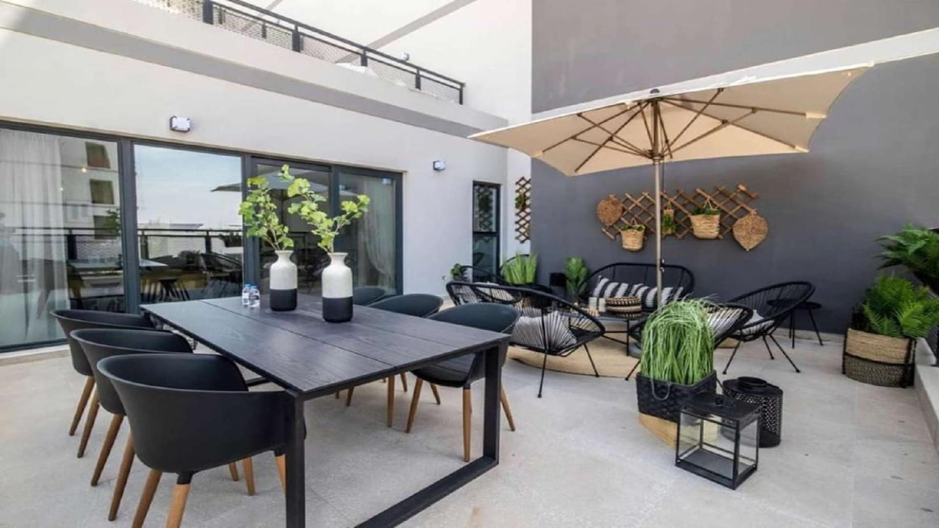 Furnished living room and kitchen in Olivara Residences apartment, Dubai Studio City for rent