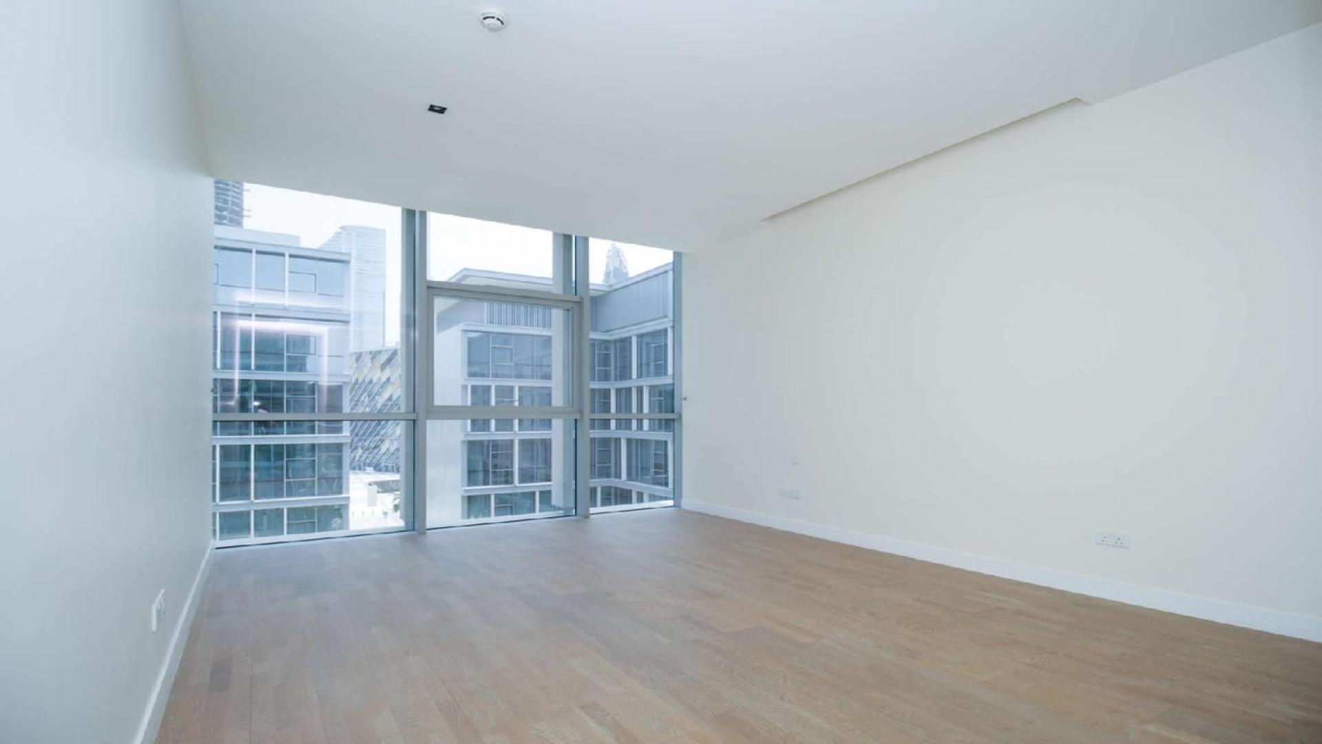 Spacious living area with modern kitchen in City Walk apartment, Dubai