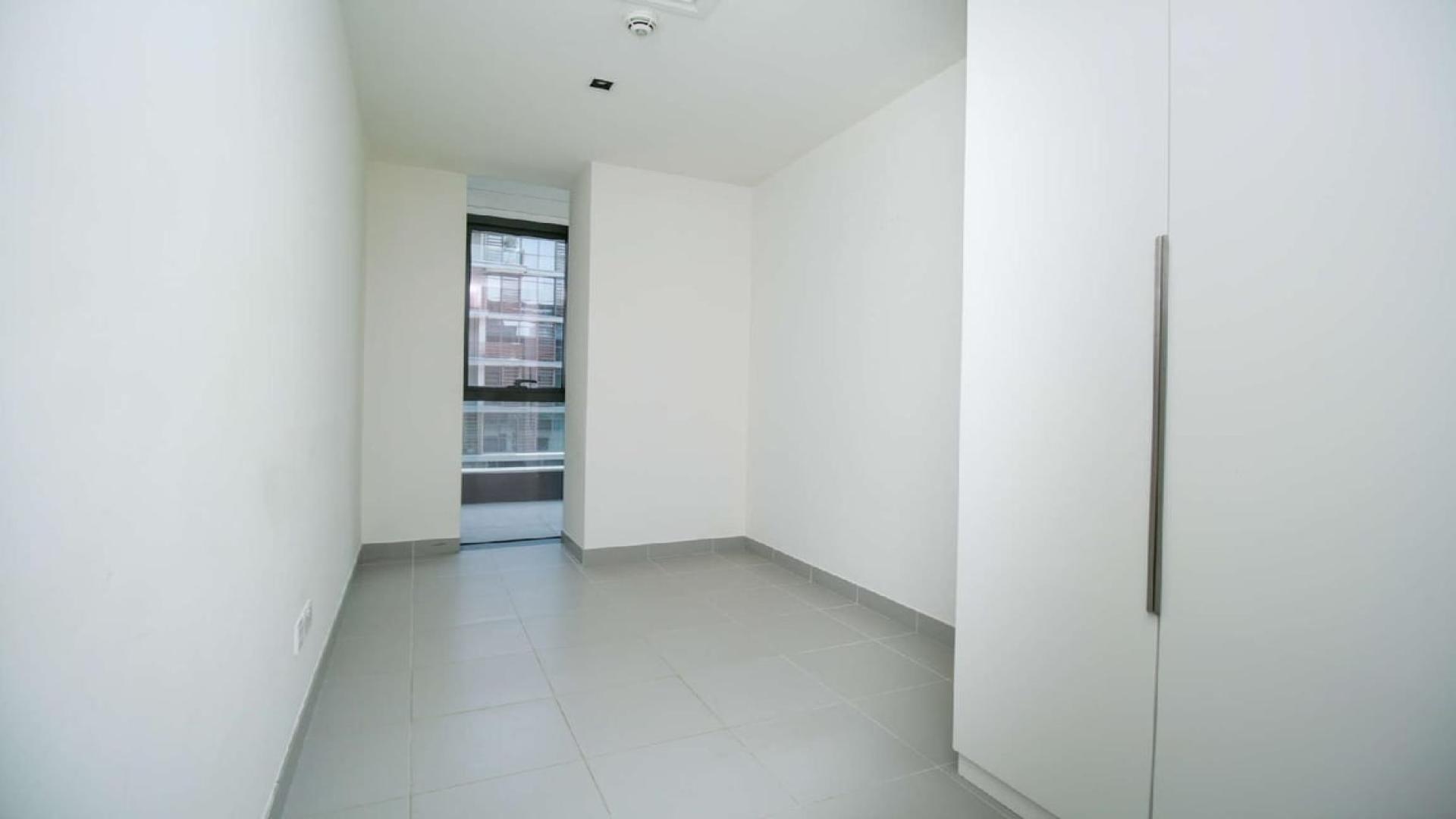 Balcony view from three-bedroom apartment in City Walk, Jumeirah, overlooking modern buildings