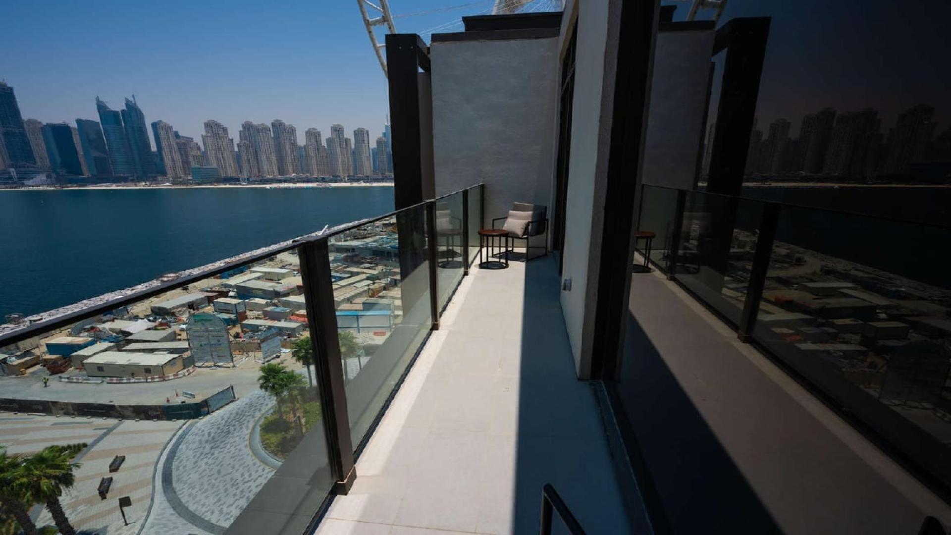 Balcony view from 3-bedroom apartment at Caesars Bluewaters Dubai overlooking the sea and skyline