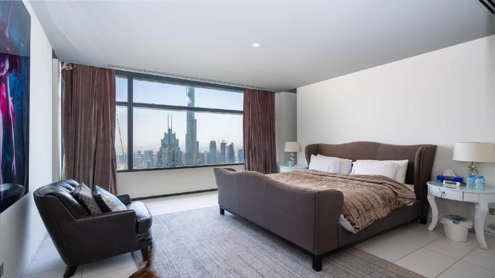 Luxurious living room in three-bedroom DIFC Index Tower apartment with stunning city views