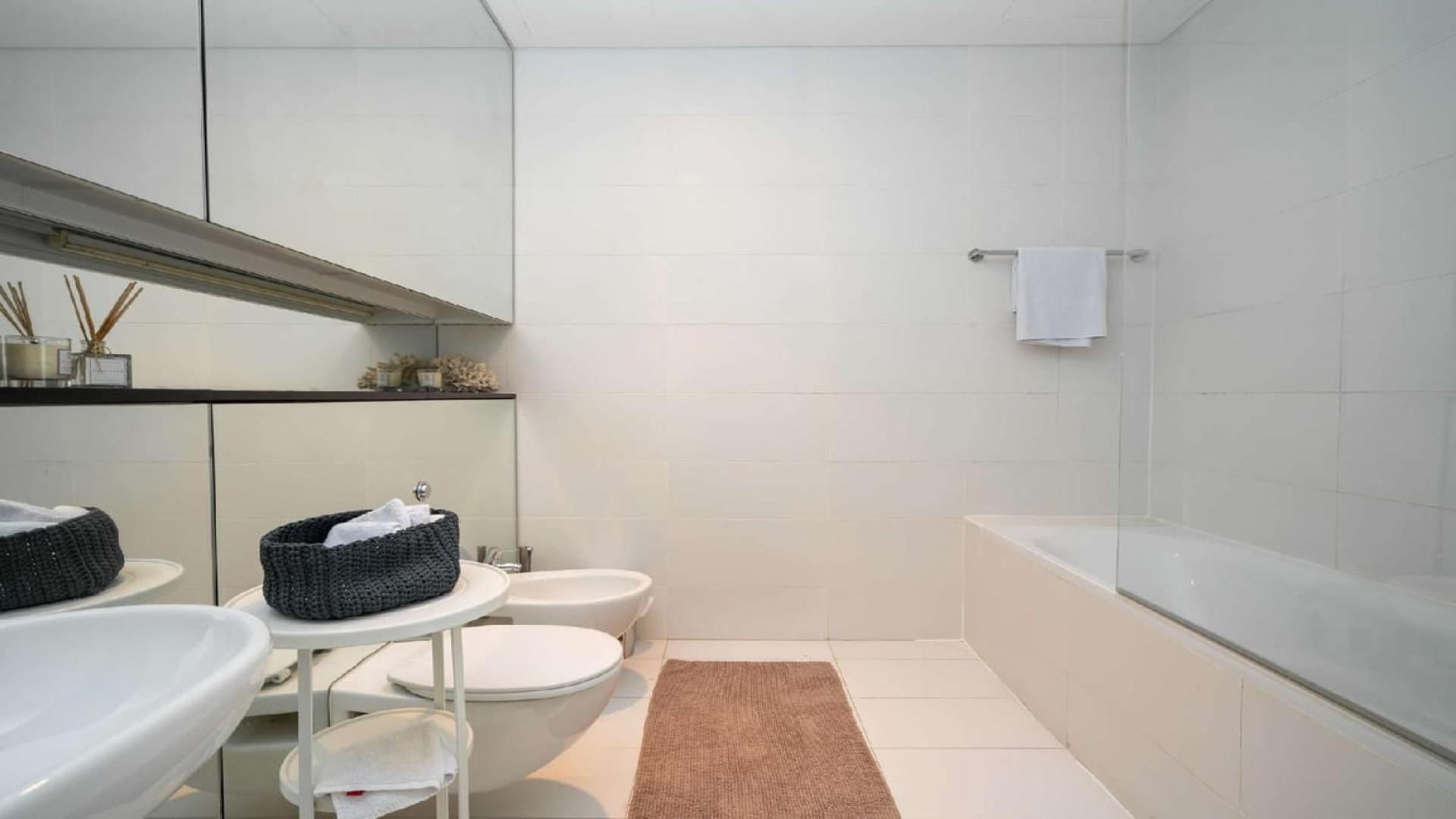 Luxurious living room with city view in DIFC Index Tower three-bedroom apartment