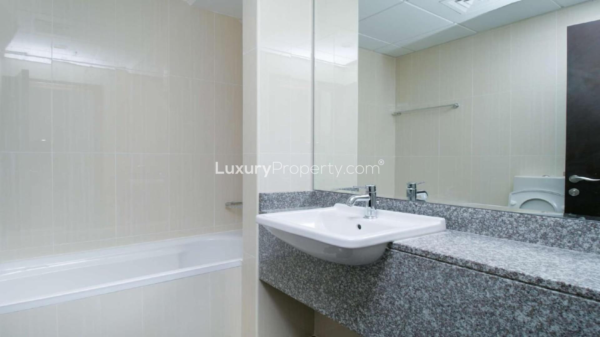 "Beachfront balcony view from Sarai Apartments, Palm Jumeirah, available for rent.",Empty bedroom in beachfront apartment, Sarai Apartments, Palm Jumeirah, with built-in wardrobes