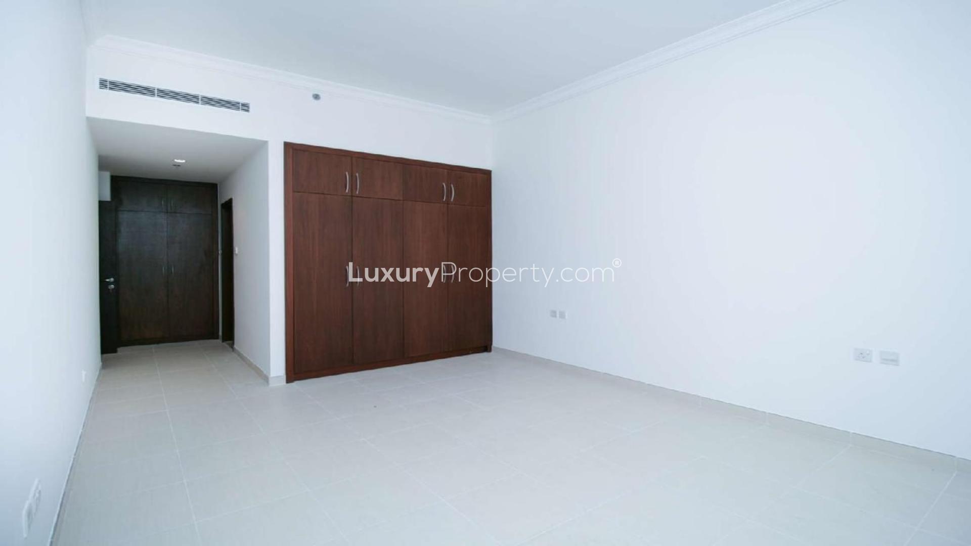 Beachfront view from Sarai Apartments, Palm Jumeirah, showcasing lush greenery and skyline