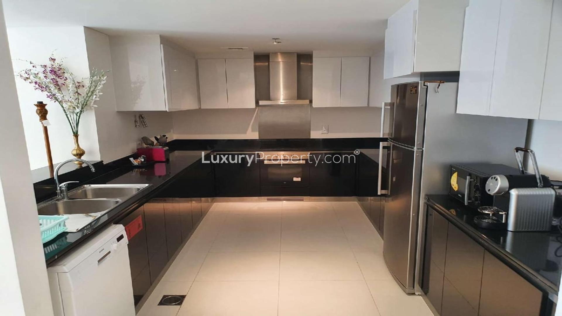 N/A,Modern kitchen in Damac Heights apartment, featuring sleek cabinetry and stainless steel appliances