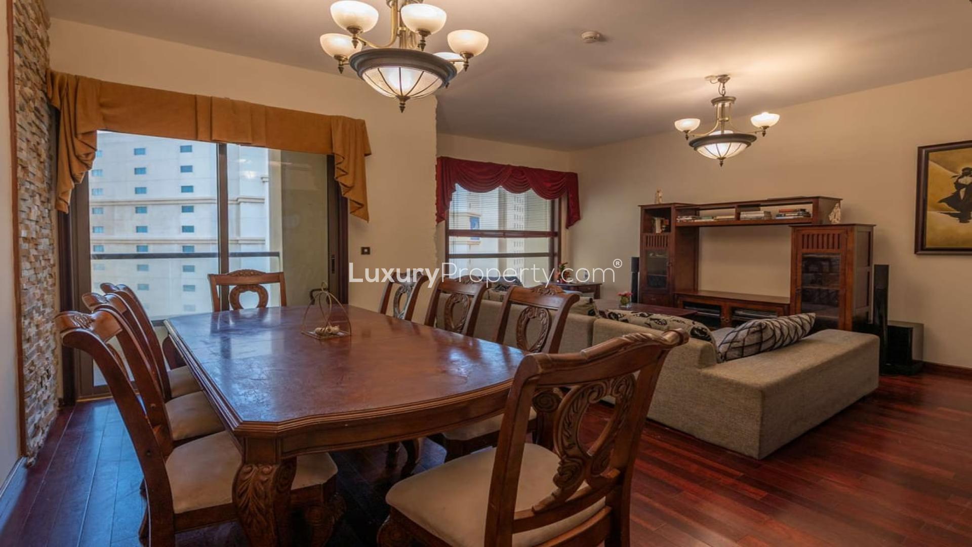 Furnished bedroom in Jumeirah Beach Residence apartment, featuring elegant decor and natural light