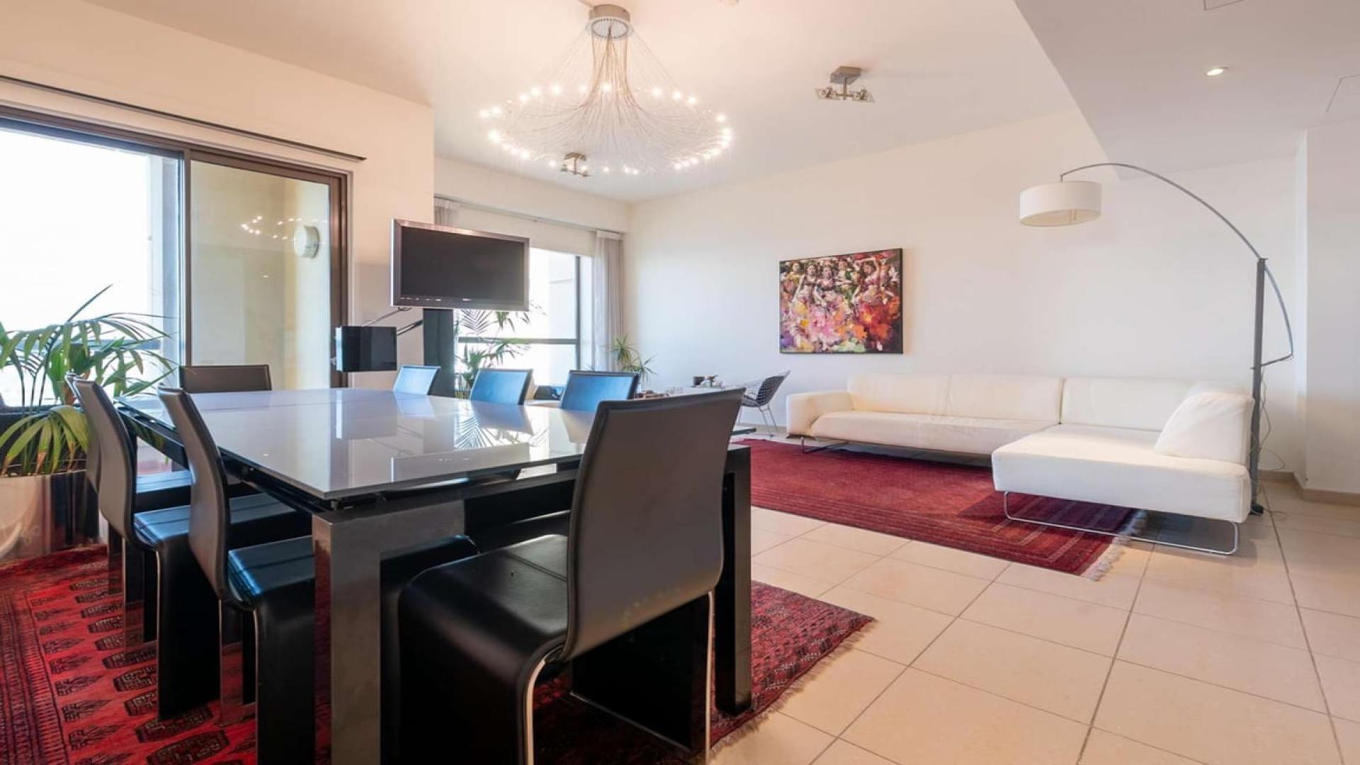 Spacious living and dining area in Rimal 6 apartment, JBR, with modern decor and lighting