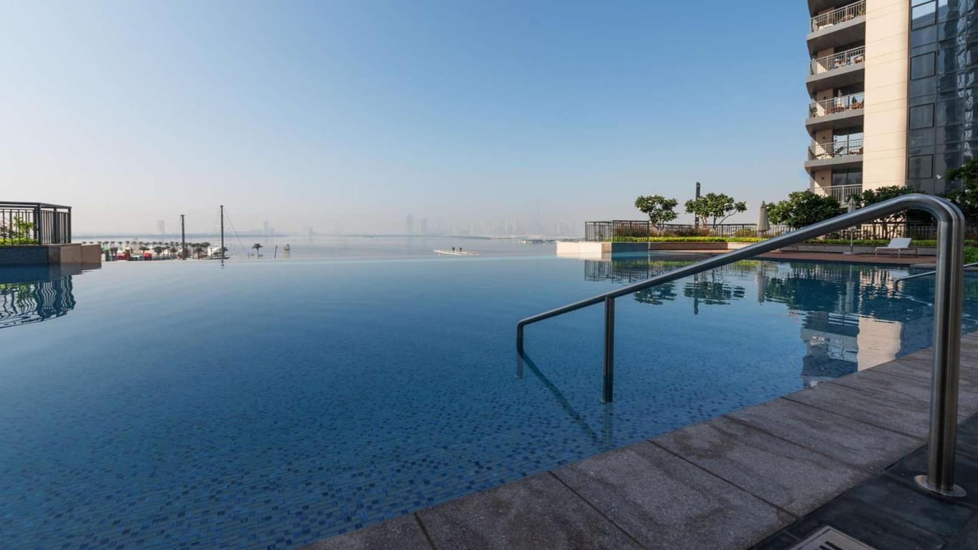 Creek-view apartment living room with large windows in Dubai Creek Residences, Dubai Creek Harbour