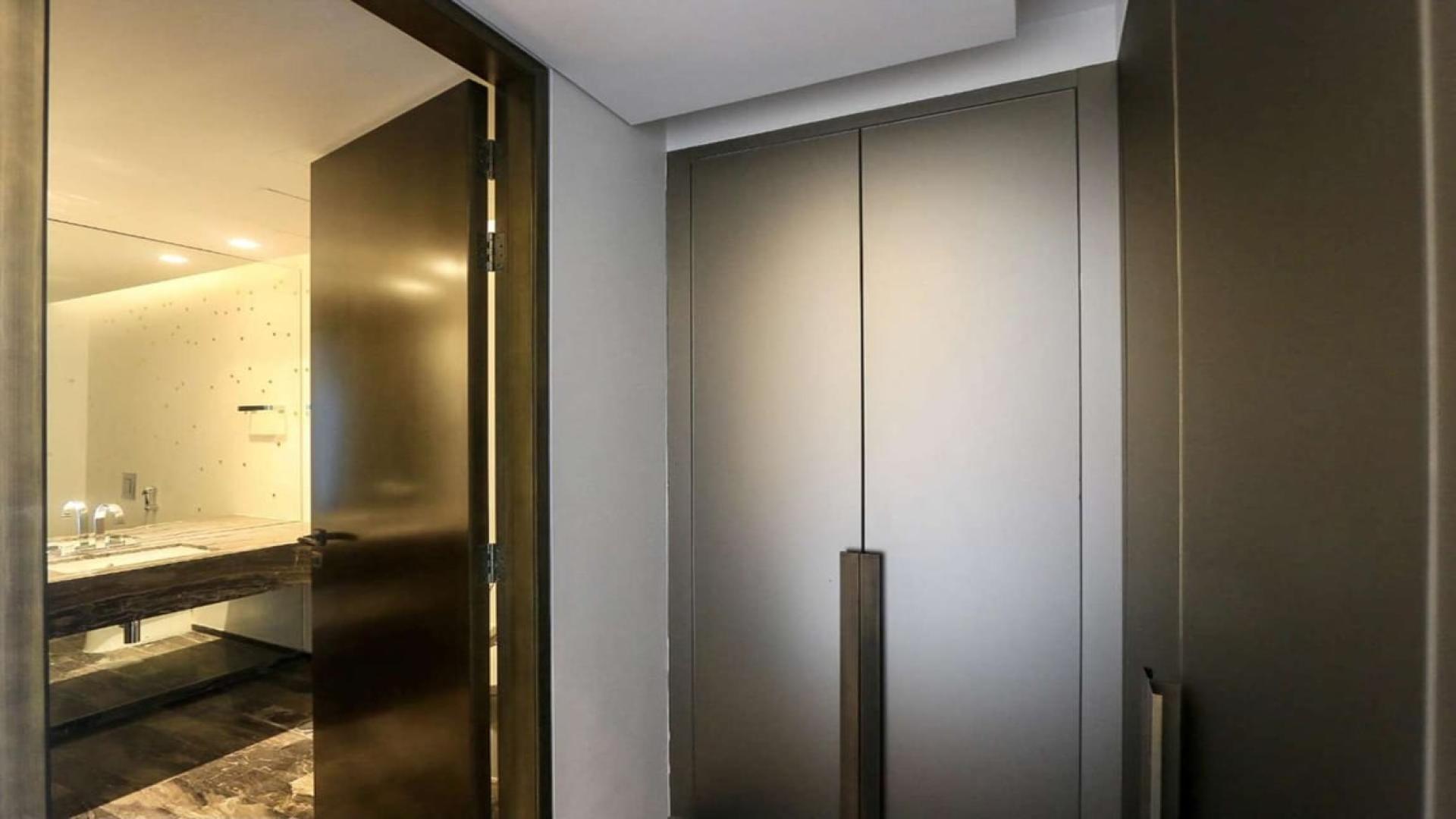 "Modern bathroom entrance in Fendi design apartment, Damac Heights, Dubai Marina, available for rent.",Modern kitchen in brand new Fendi design apartment, Damac Heights, Dubai Marina