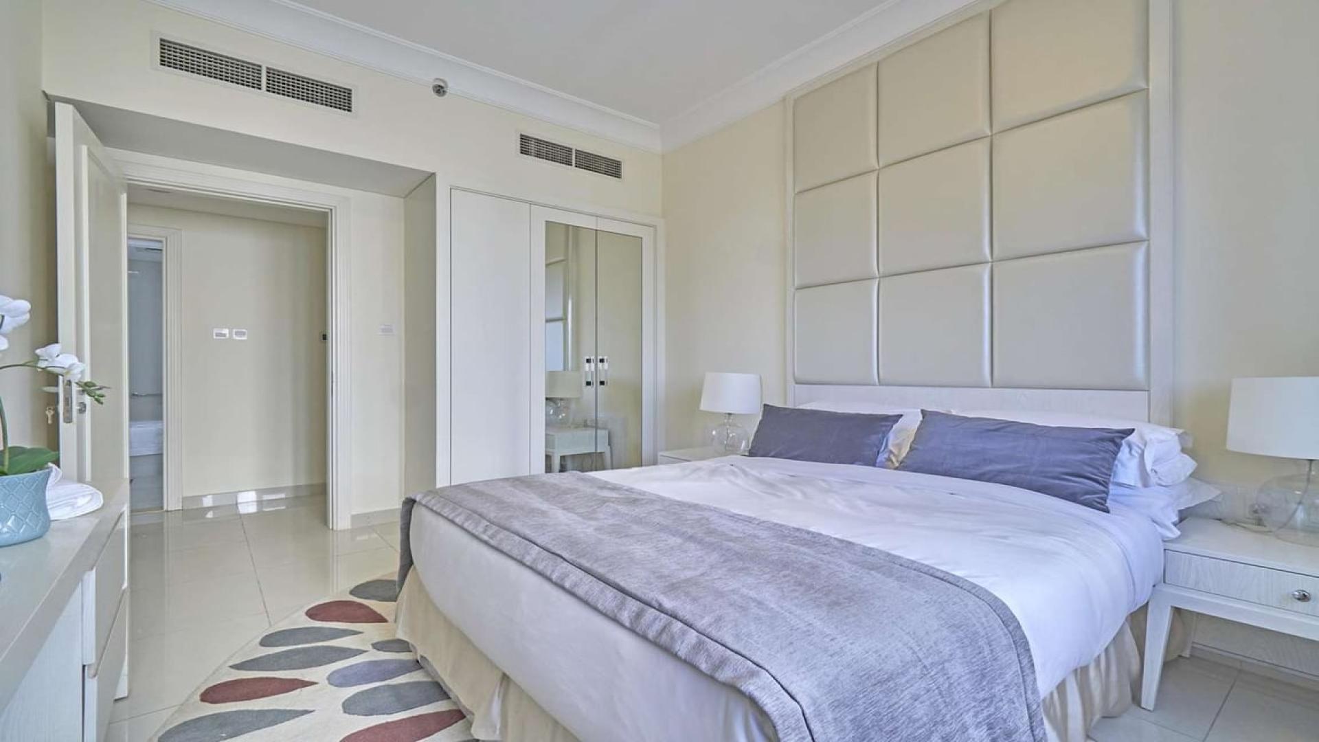 Modern living room in luxury 3-bedroom apartment, Downtown Dubai, with elegant decor and city view