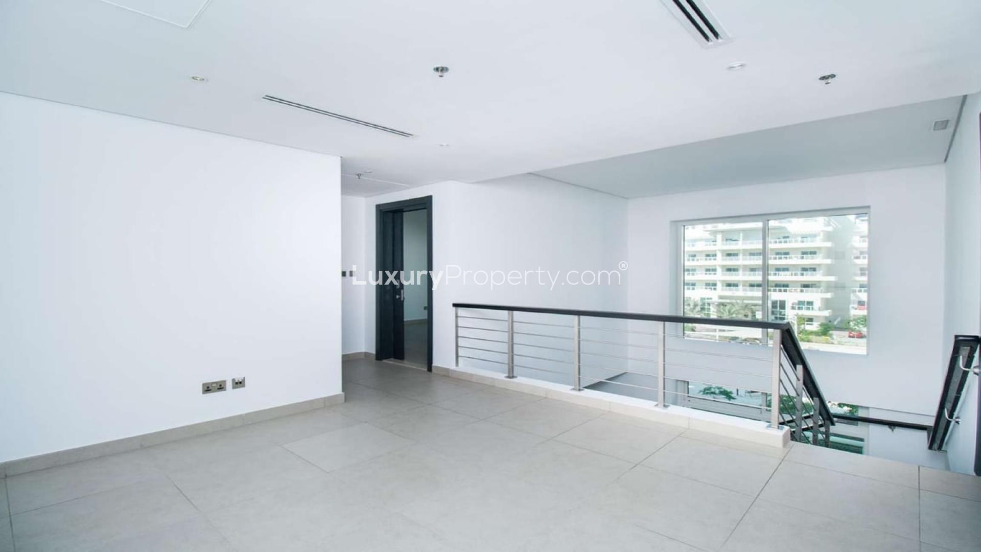 Modern interior of 3-bedroom duplex apartment in Jumeirah Heights, featuring spacious landing area