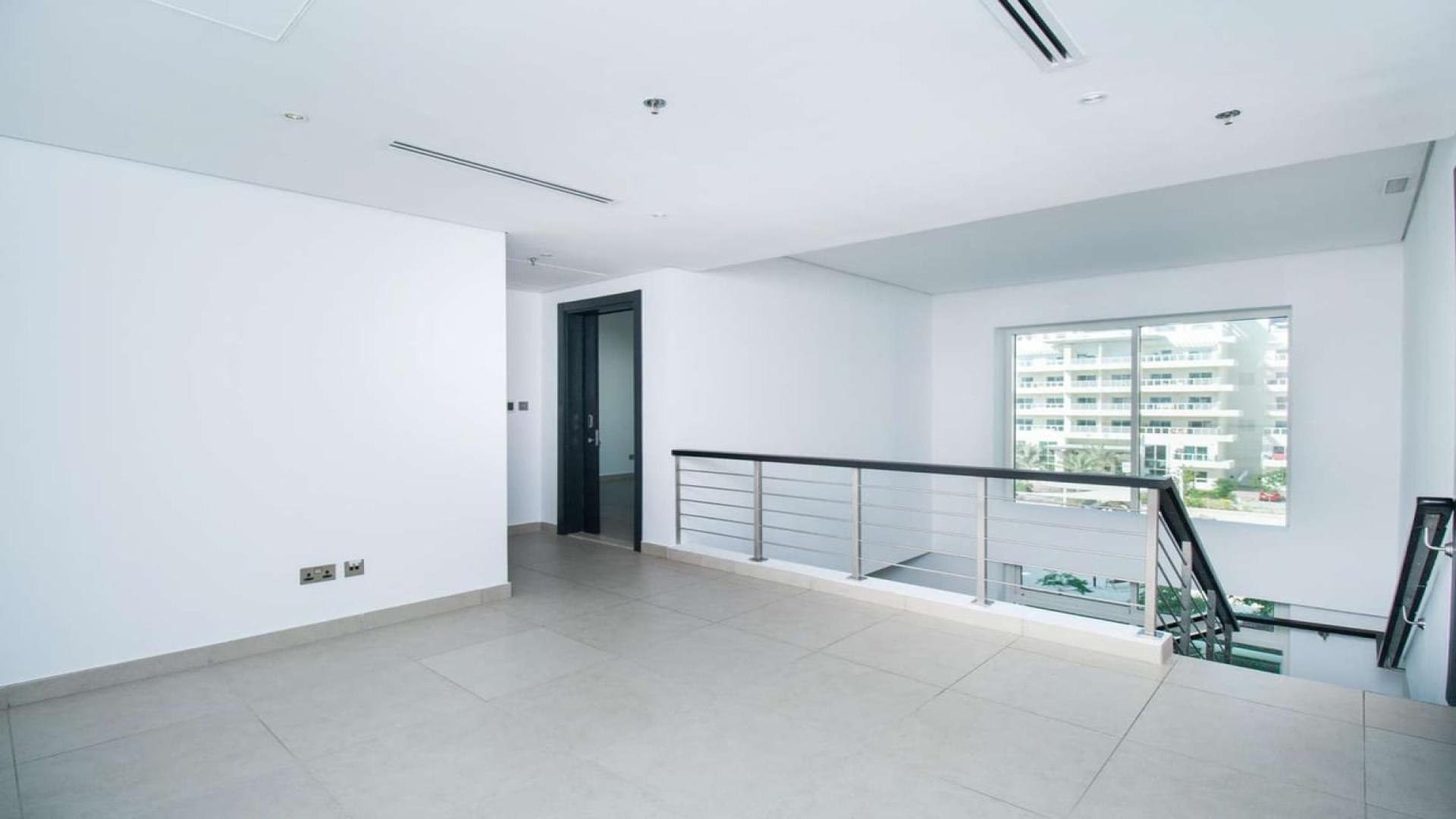 Modern interior of 3-bedroom duplex apartment in Jumeirah Heights, featuring spacious landing area