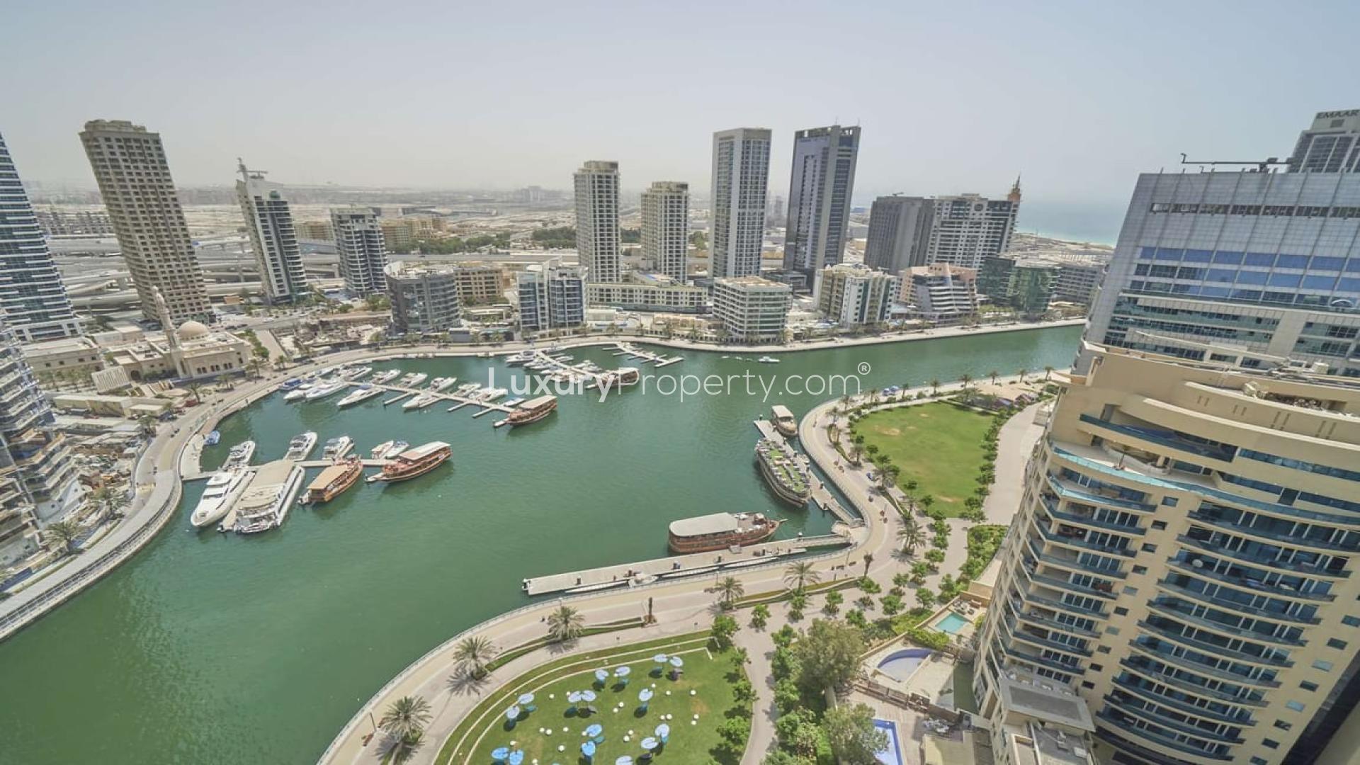 "Balcony view of Dubai Marina from 3-bedroom apartment in Sparkle Towers for rent.",Aerial view of Dubai Marina from 3-bedroom apartment in Sparkle Towers for rent