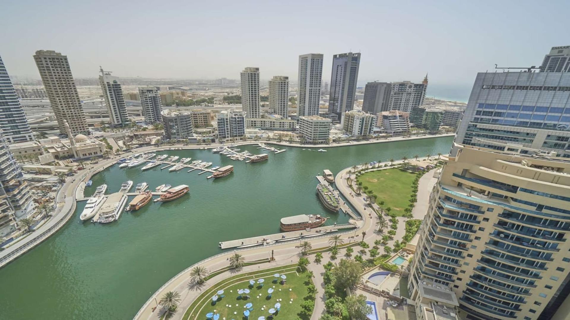 "Balcony view of Dubai Marina from 3-bedroom apartment in Sparkle Towers for rent.",Aerial view of Dubai Marina from 3-bedroom apartment in Sparkle Towers for rent