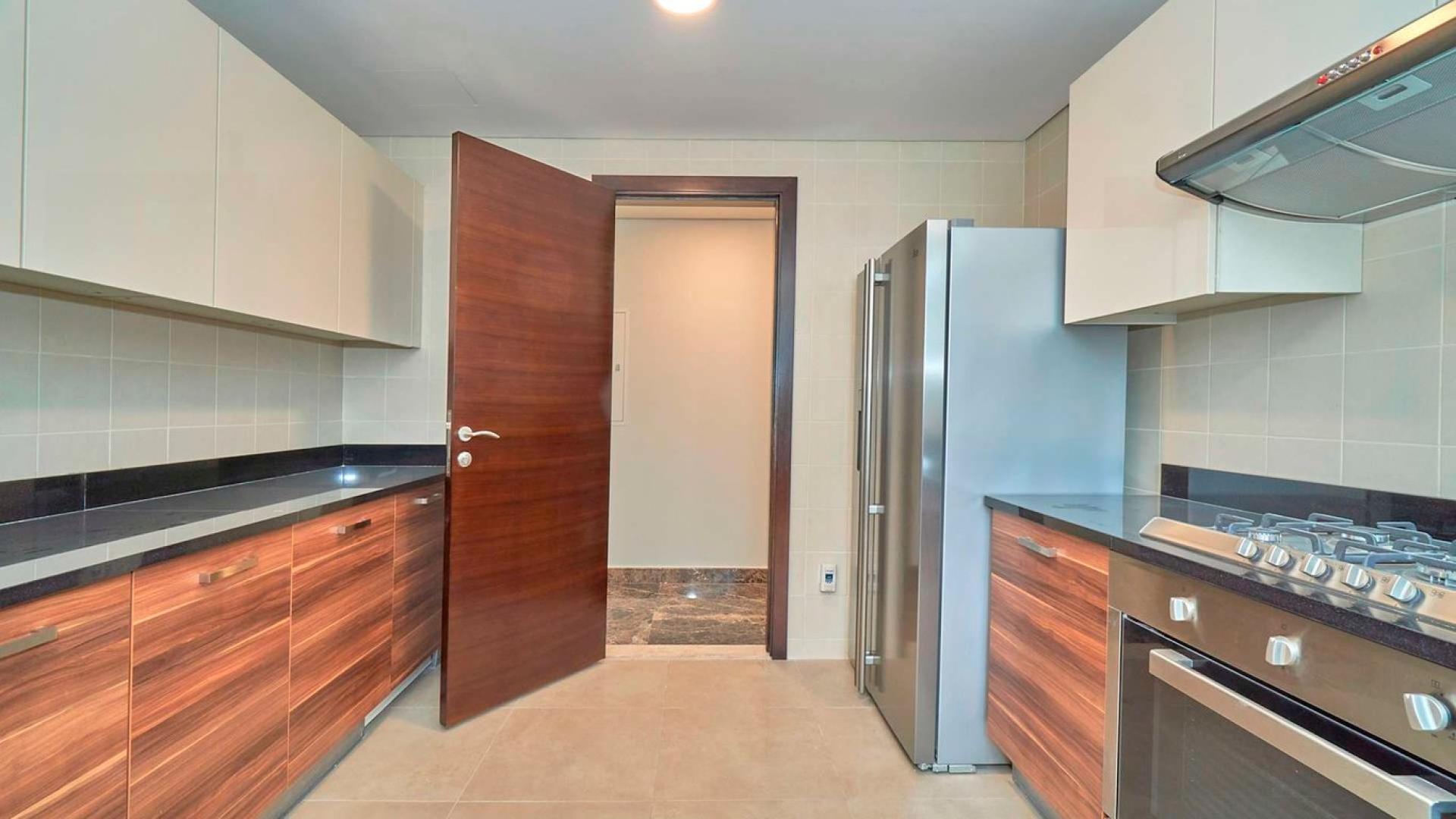 "Stunning Marina view from 3-bedroom apartment in Sparkle Towers, Dubai Marina for rent.",Modern kitchen in 3-bedroom apartment, Sparkle Towers, Dubai Marina, with sleek cabinets and appliances