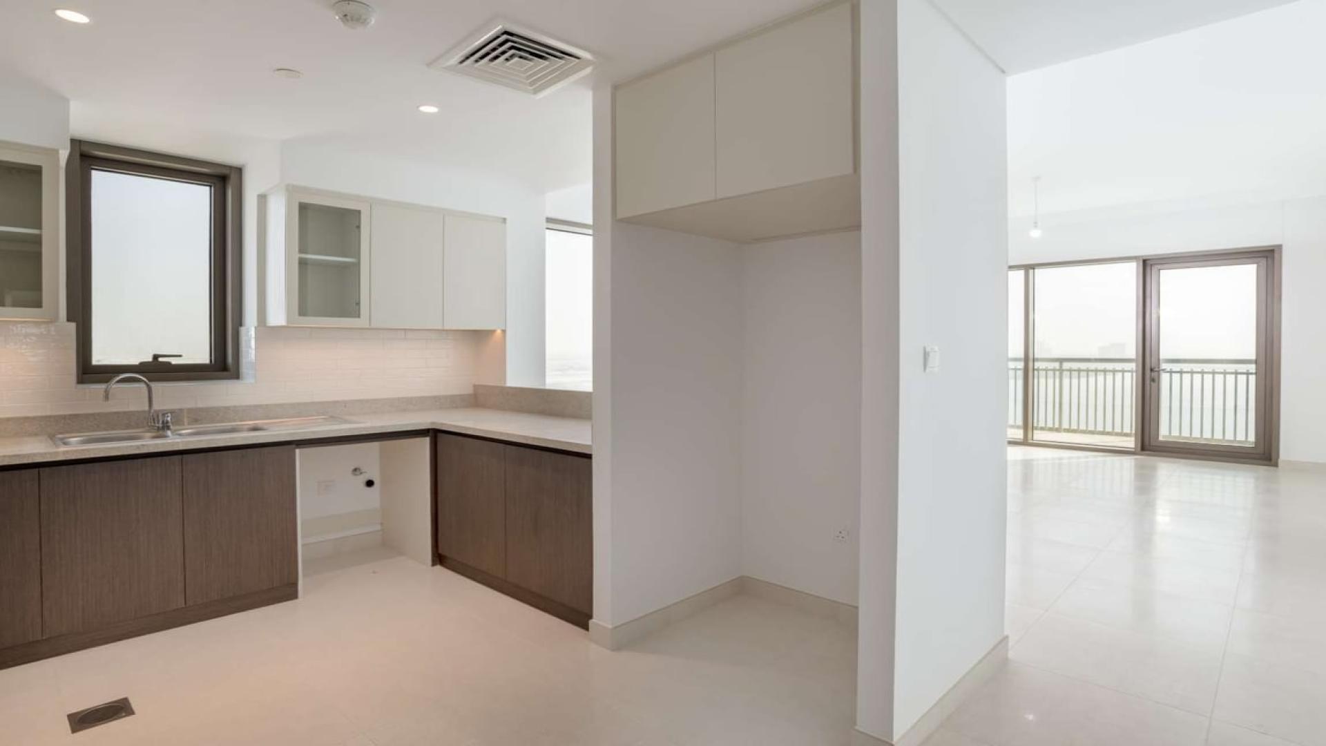 Spacious living room with large windows in Creekside 18 apartment, Dubai Creek Harbour