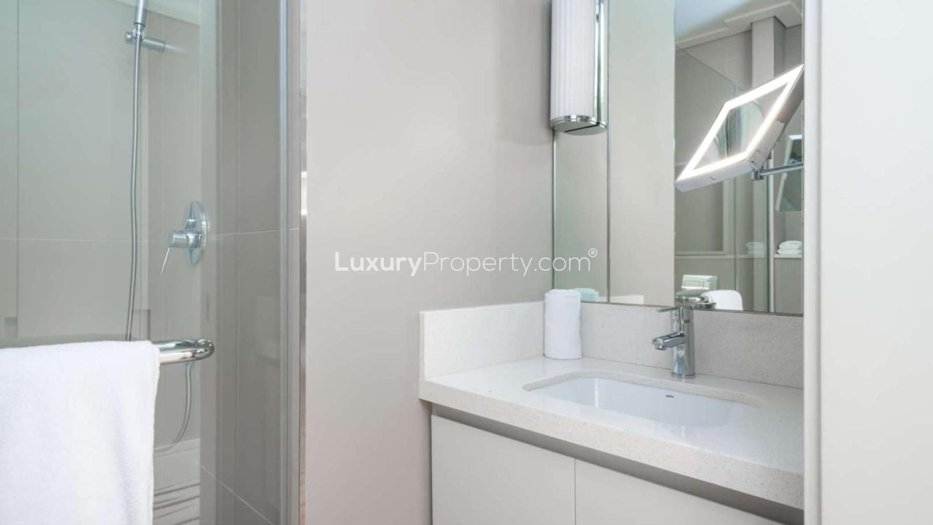 Modern living room in 3-bedroom apartment, Vida Residences Downtown, with elegant decor and seating