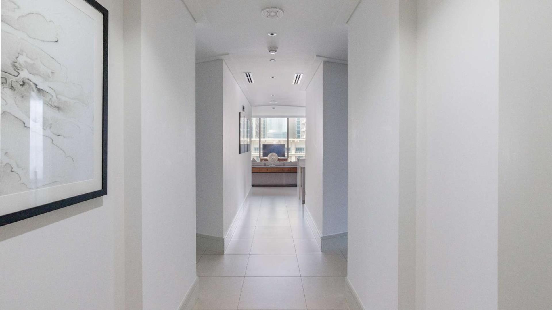 Luxurious bedroom view of pool and skyline in Vida Residences, Downtown Dubai apartment