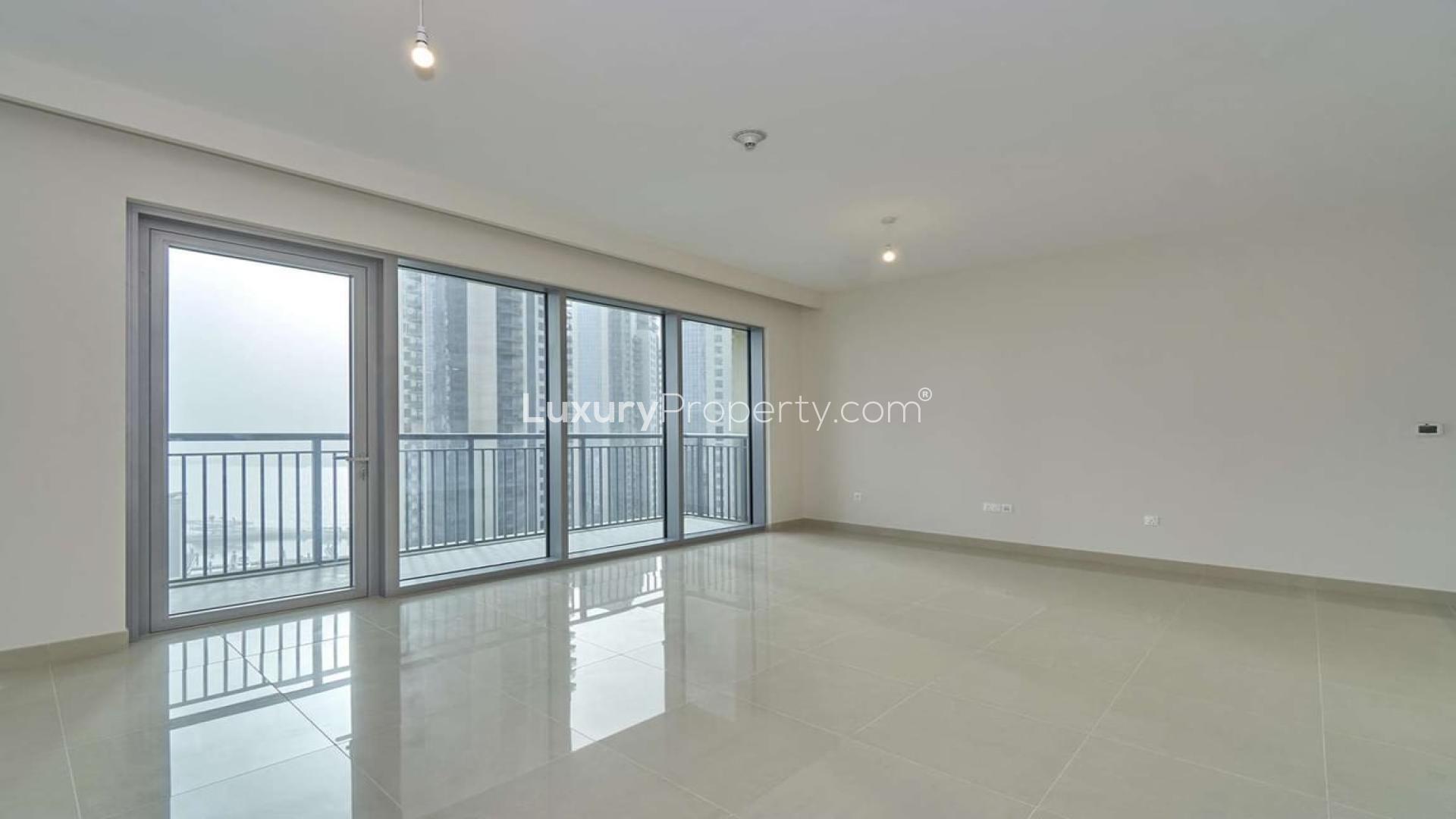 Spacious living room with large windows in Dubai Creek Harbour apartment for rent
