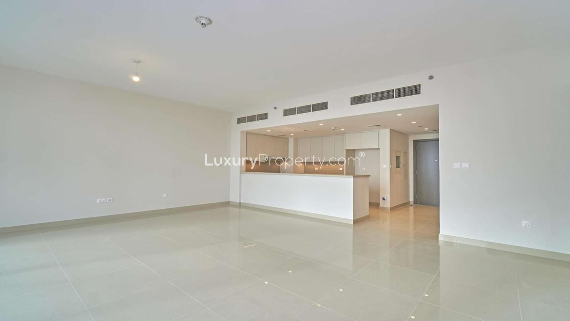 Modern open-plan kitchen and living area in Dubai Creek Harbour apartment for rent