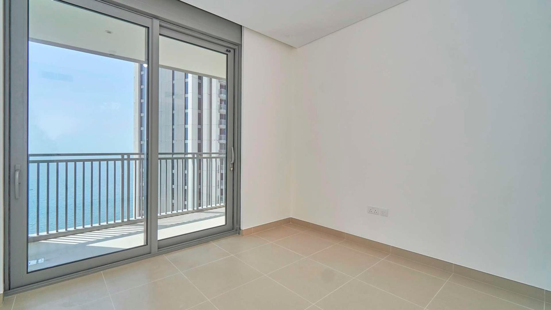 Aerial view of Dubai Marina near 52/42 Towers, showcasing waterfront and iconic skyline