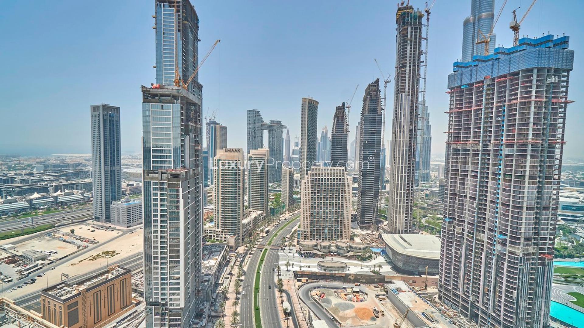 Bright living room with floor-to-ceiling windows in BLVD Heights apartment, Downtown Dubai