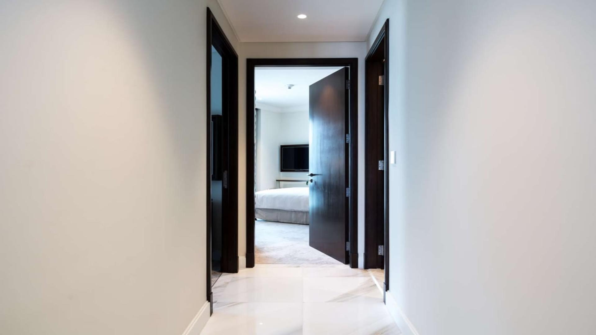 Luxurious living room in Downtown Dubai apartment with stunning city views, elegant decor