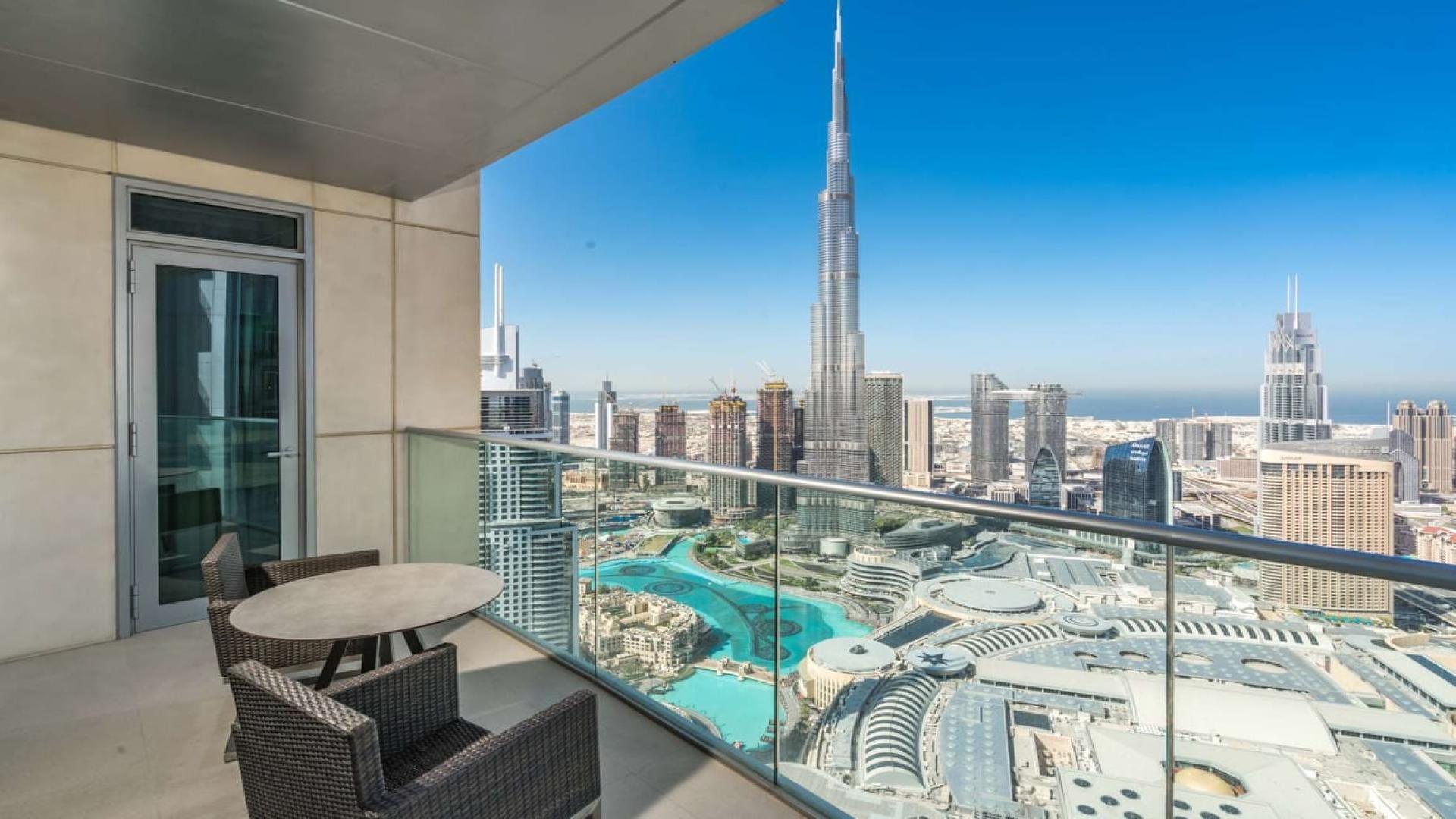 High-floor apartment balcony view of Downtown Dubai skyline and Burj Khalifa