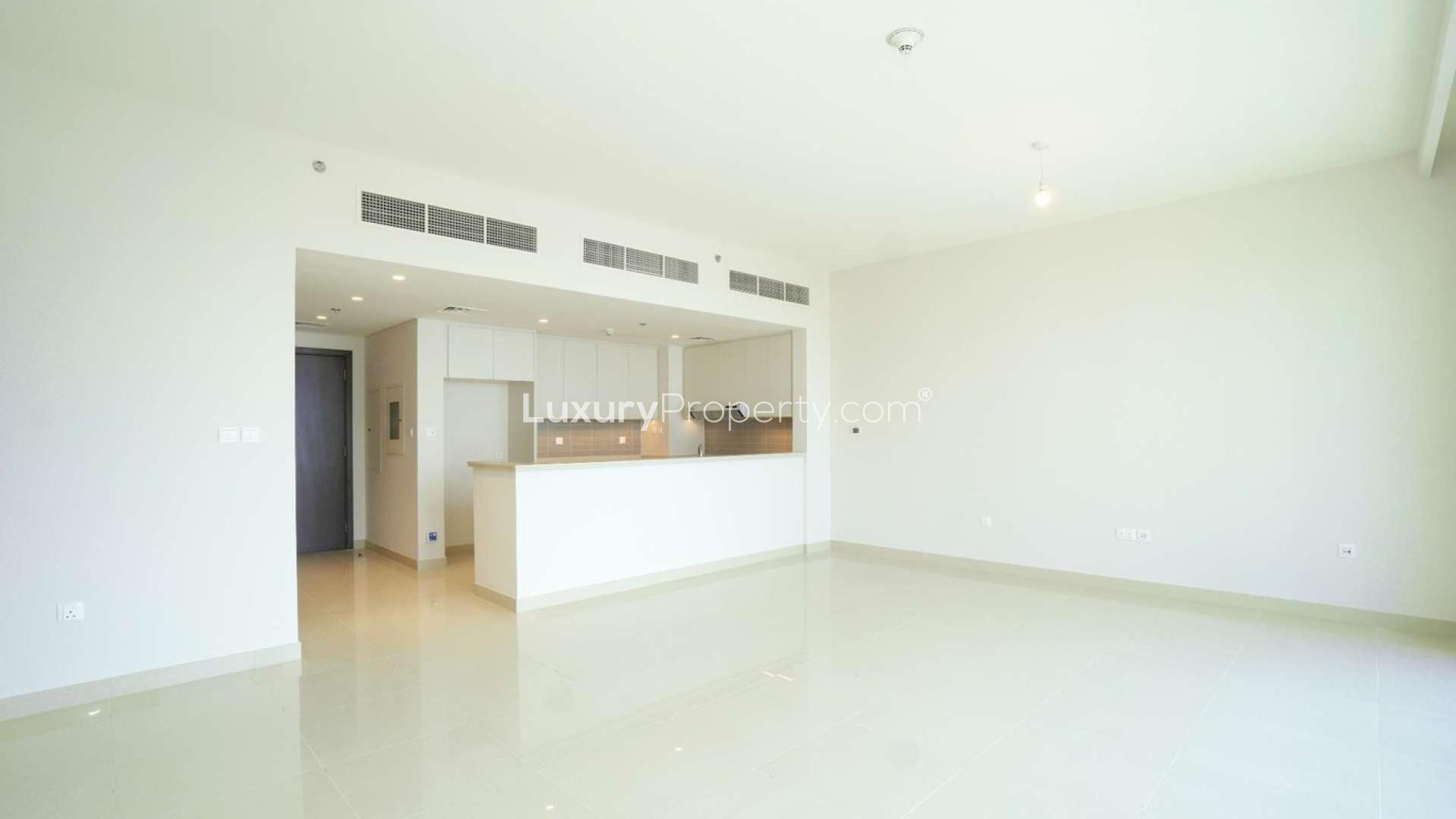 Three-bedroom apartment with large windows overlooking Dubai Creek Harbour skyline