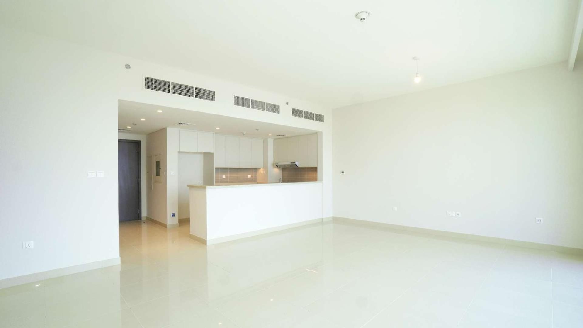 Three-bedroom apartment with large windows overlooking Dubai Creek Harbour skyline