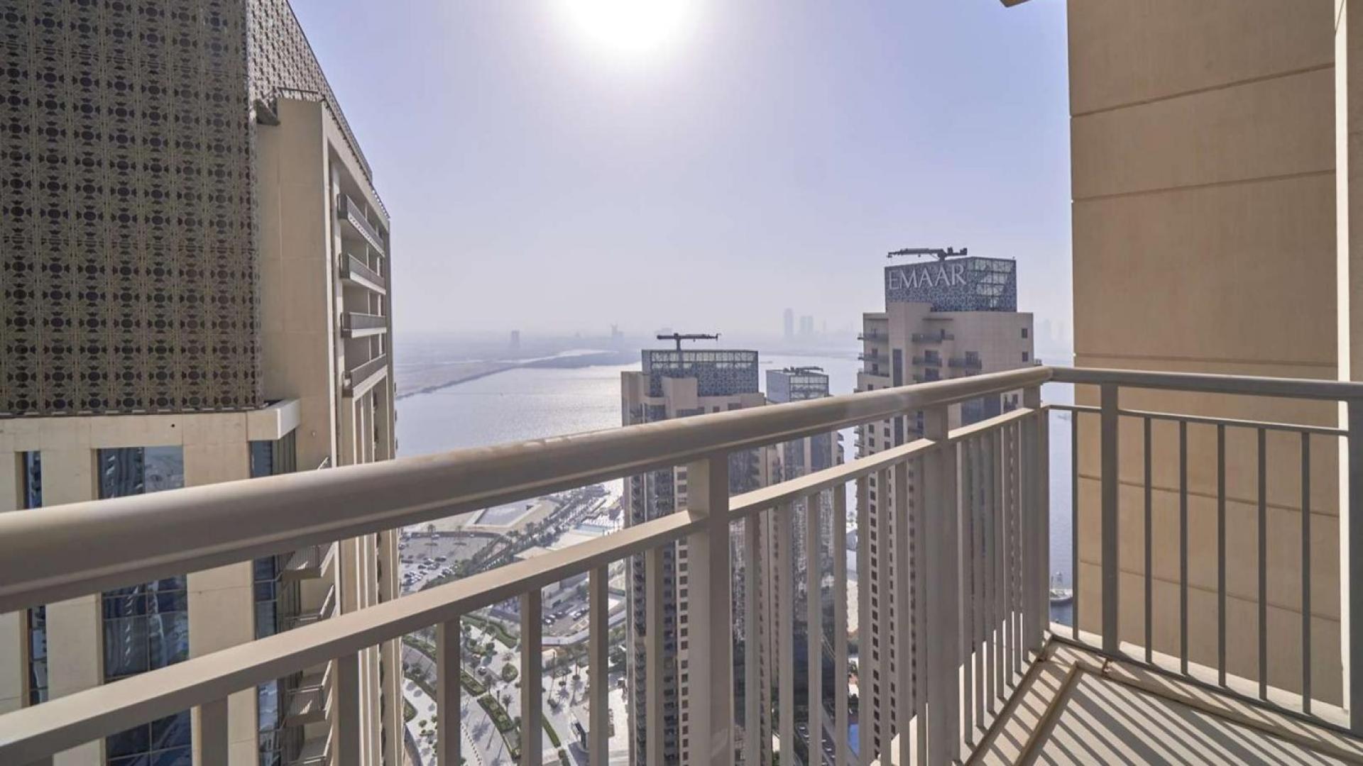 Spacious living room with large windows in Harbour Views Tower 1, Dubai Creek Harbour apartment