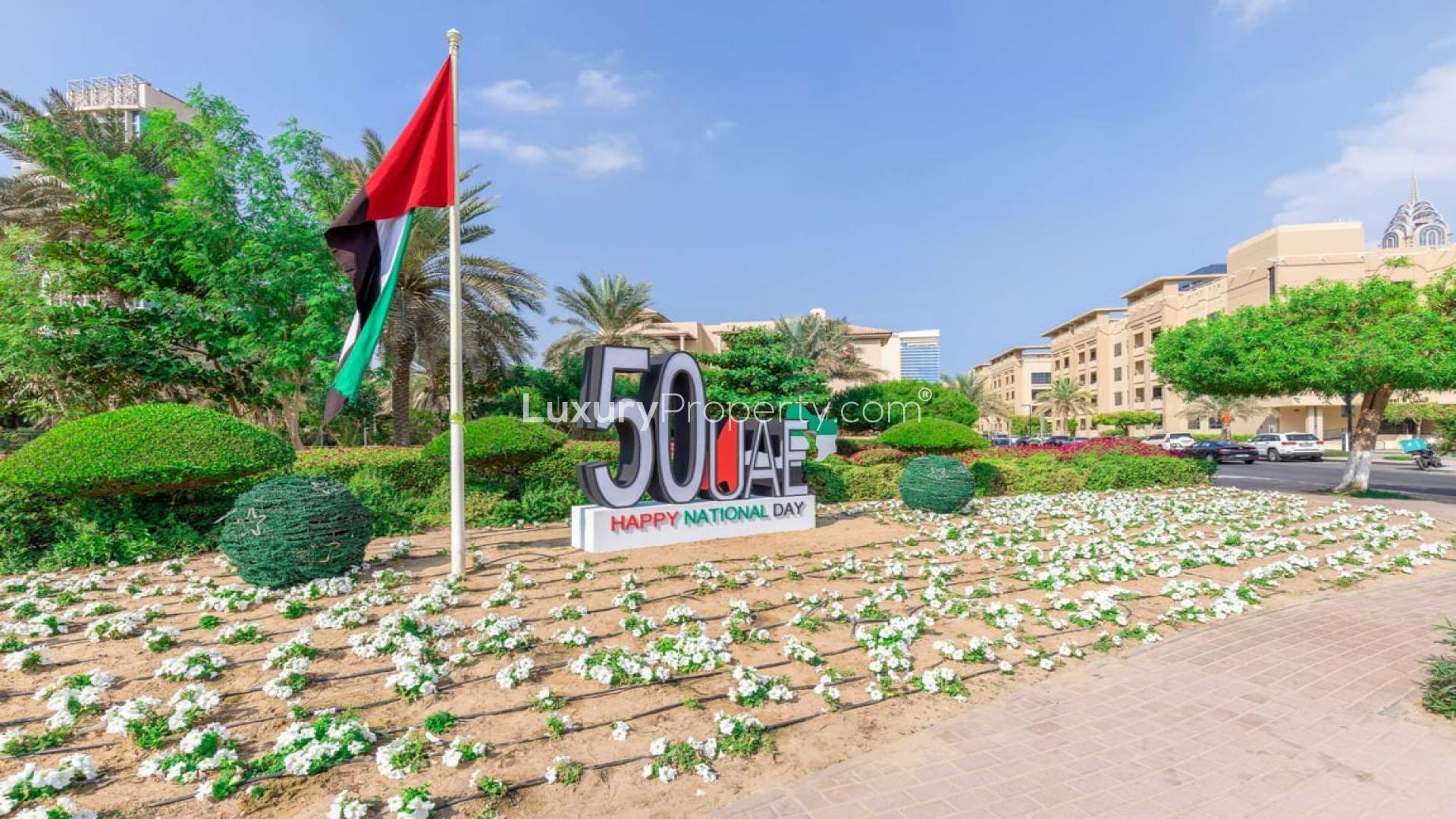 Spacious living area with balcony and open kitchen in The Views apartment for rent