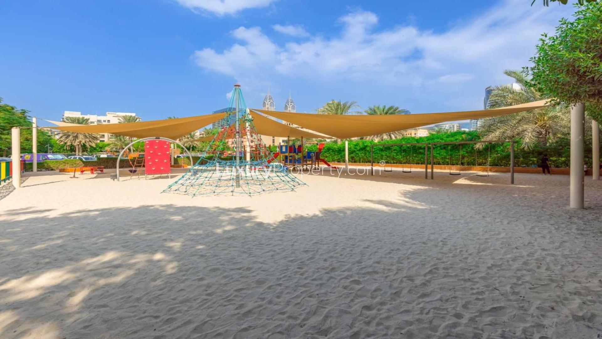 Spacious living room with large windows in The Views 2-bedroom apartment for rent