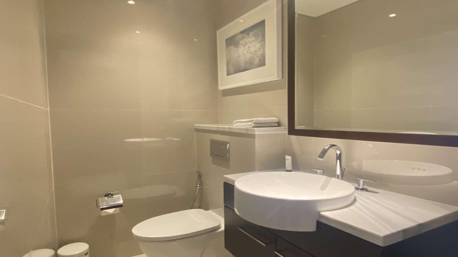 Luxury living room in Downtown Dubai apartment with Burj Khalifa views, The Address Sky View Towers