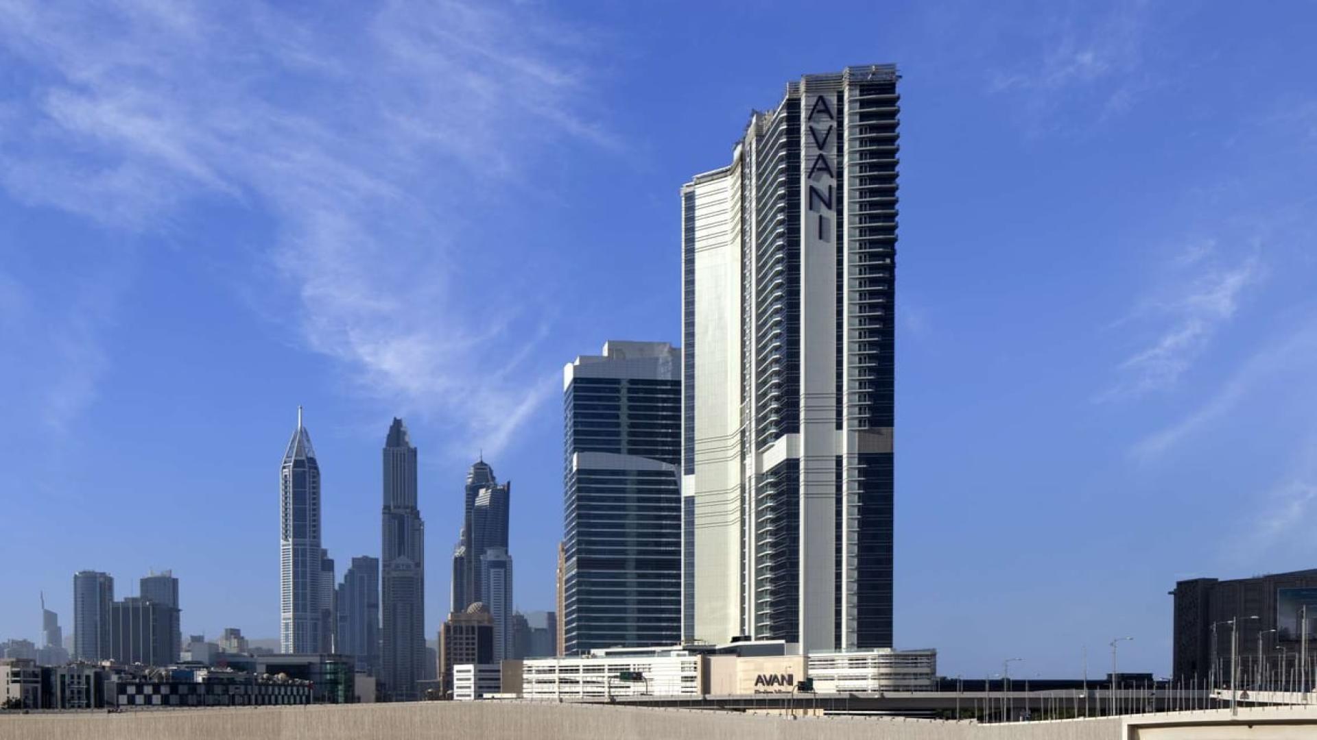 Outdoor pool at Avani Palm View Hotel, Dubai Media City, with city skyline view
