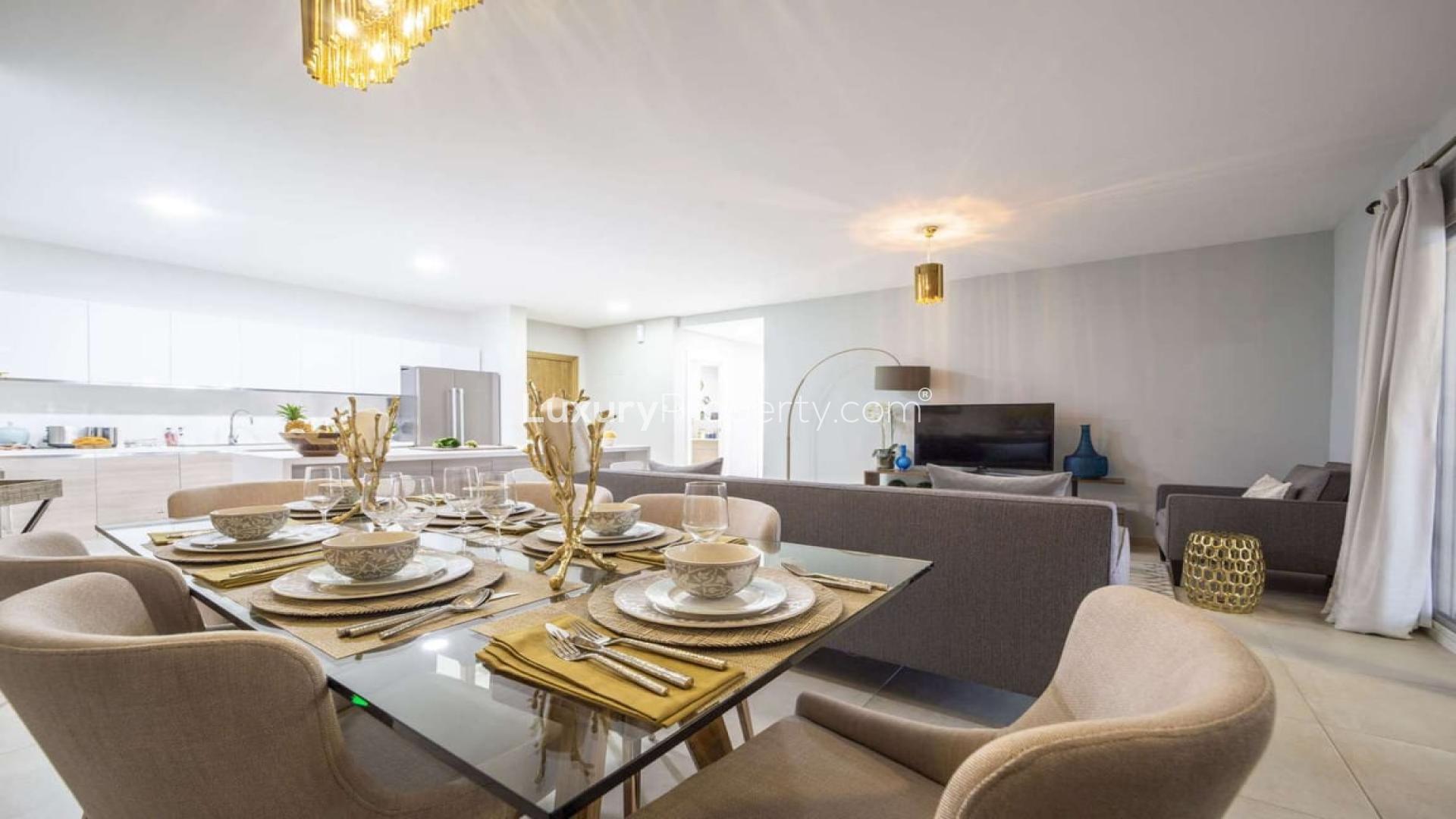 Modern living room and kitchen in Al Andalus Apartments, Jumeirah Golf Estates, available for rent