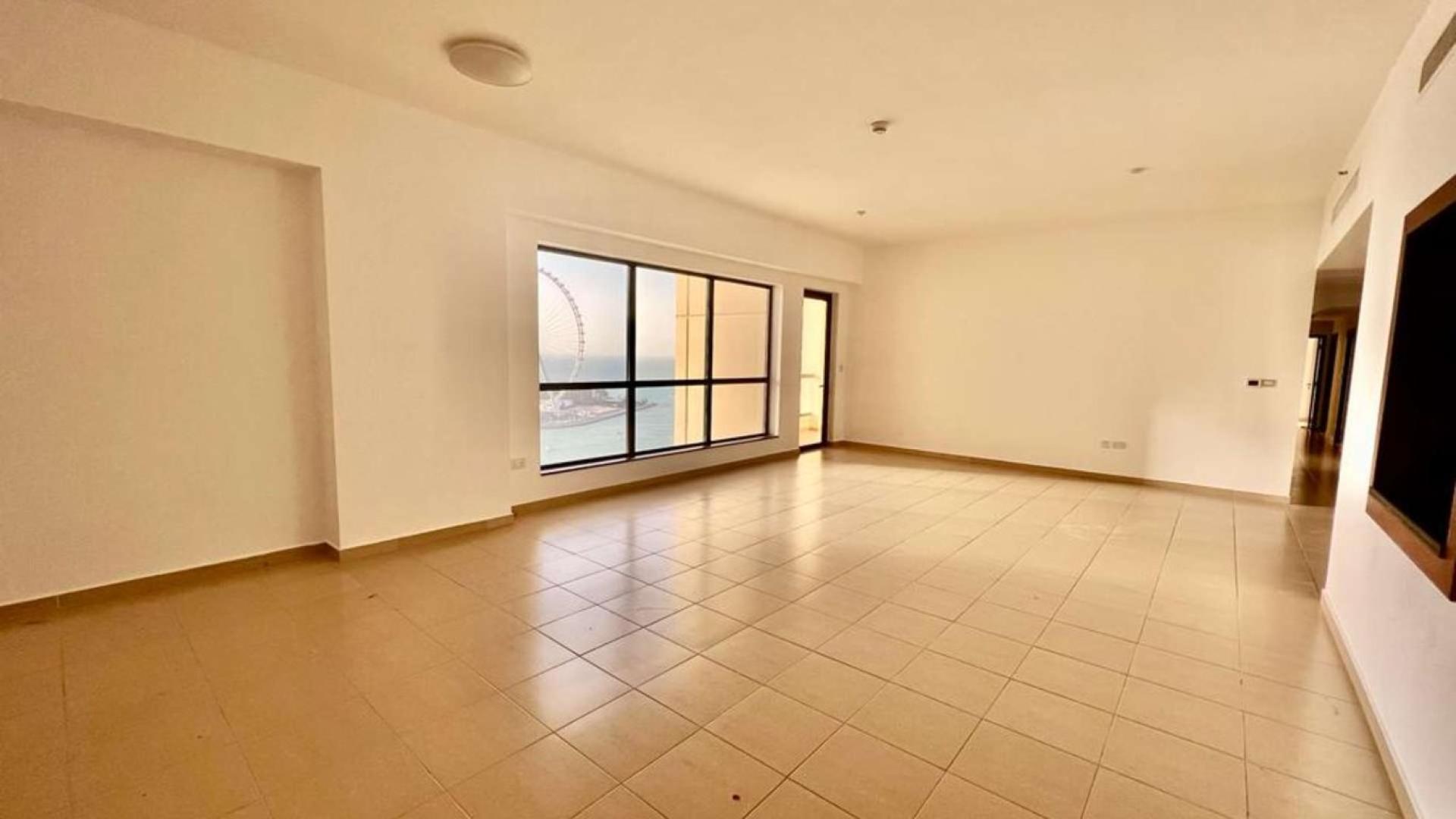 Empty living area in 3-bedroom apartment, Rimal 5, JBR, featuring tiled floors and white walls