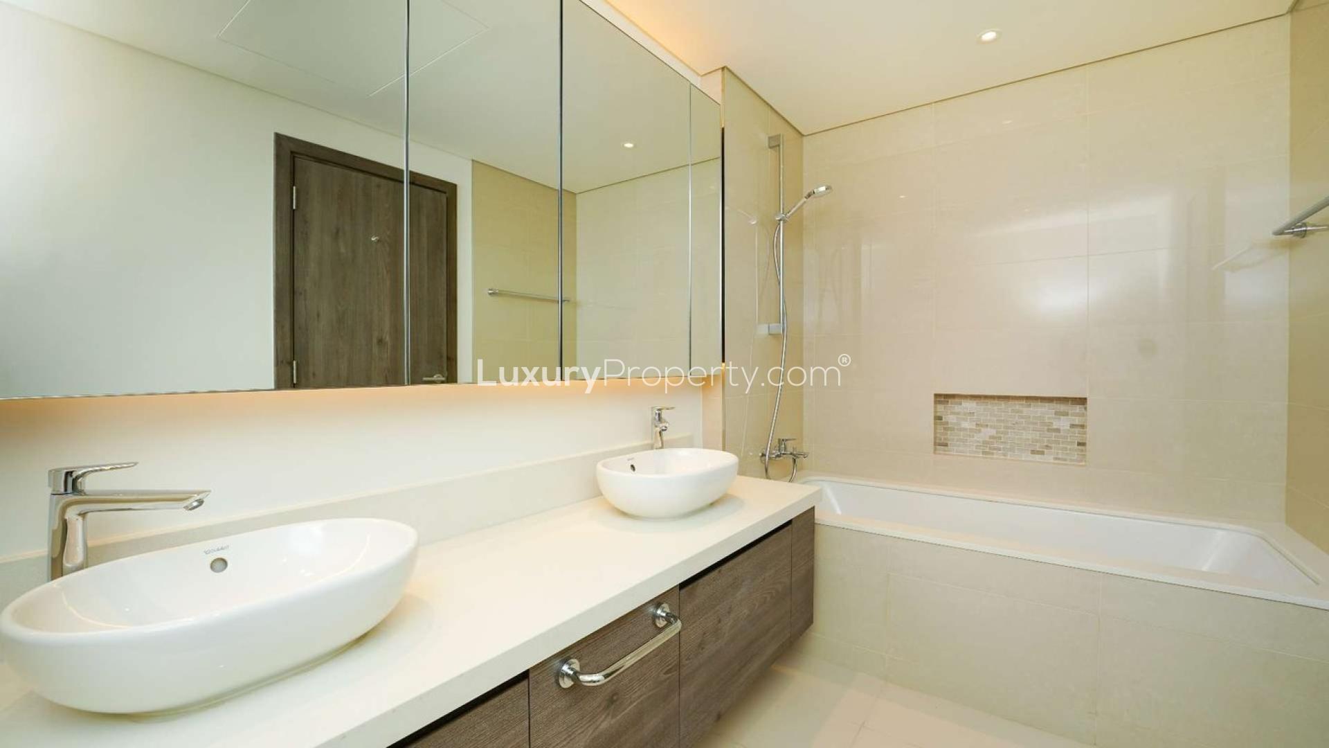 "Spacious living room with large windows in The Cove 3 apartment, Dubai Creek Harbour.",Modern bathroom in chiller-free 3-bedroom apartment, The Cove 3, Dubai Creek Harbour