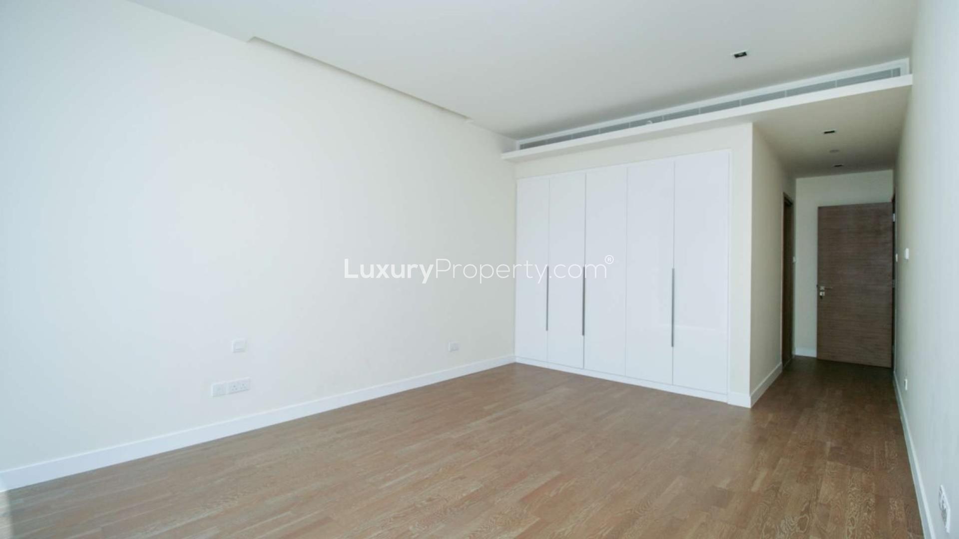 Empty room with large window in modern City Walk apartment for rent, Building 3A