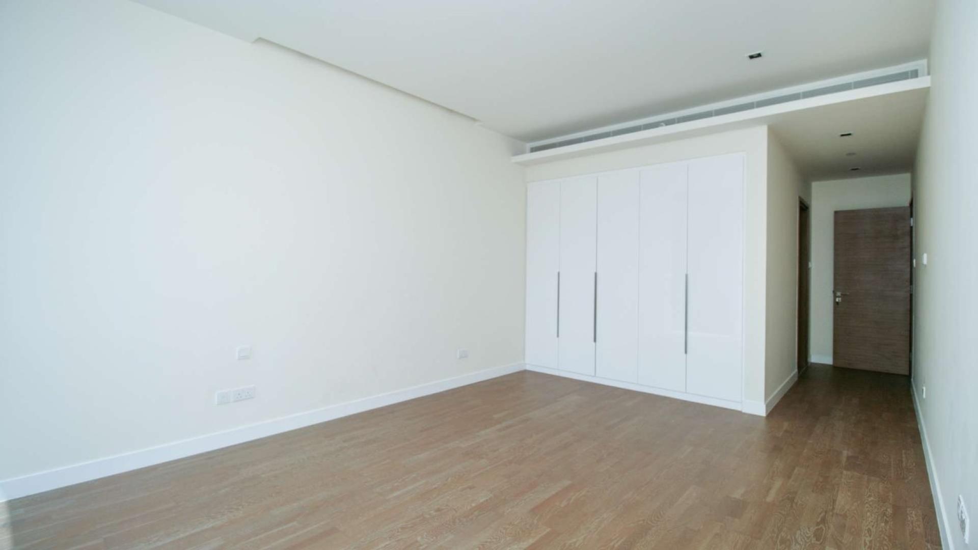 Empty room with large window in modern City Walk apartment for rent, Building 3A