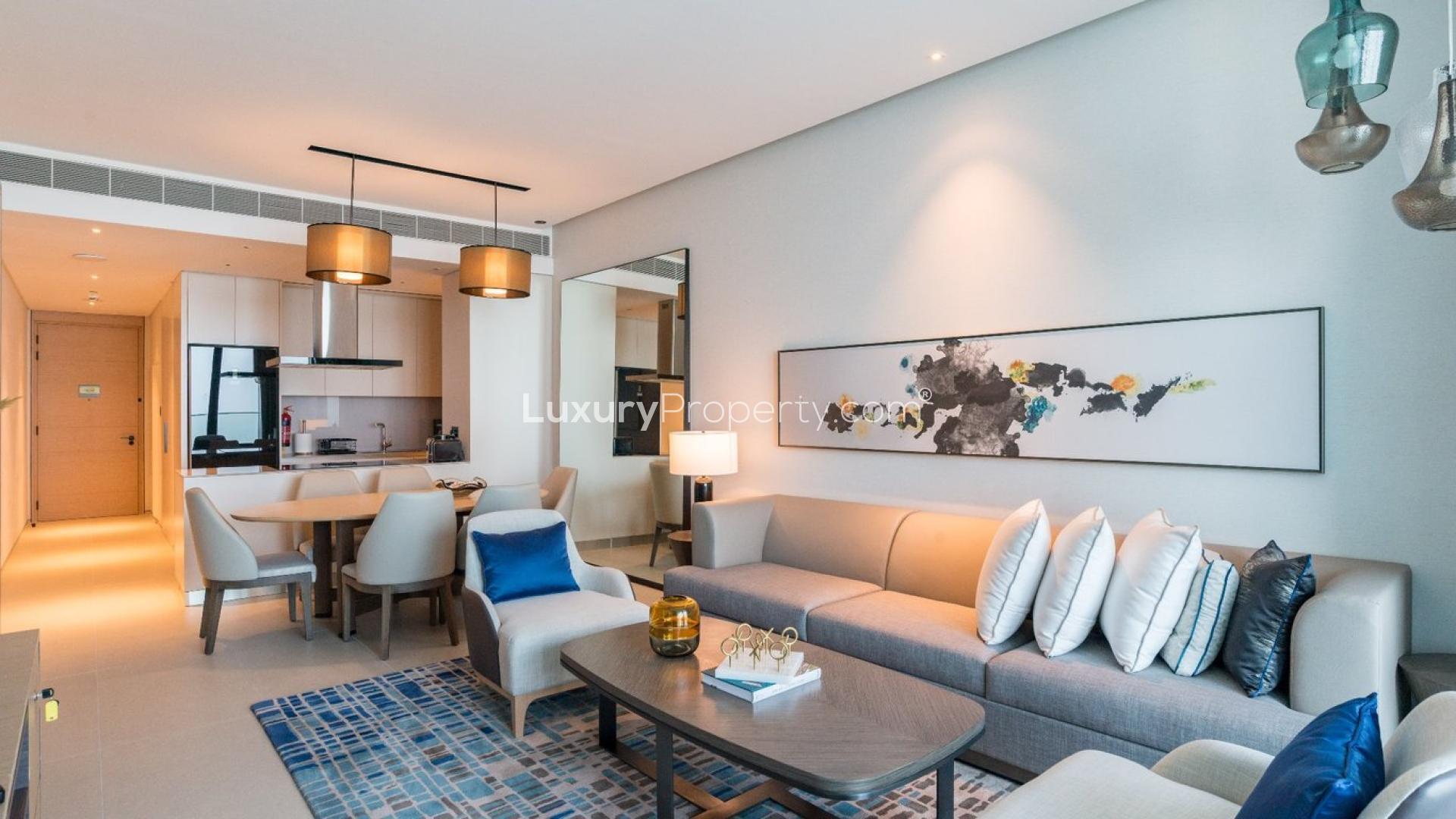 Modern living room in Jumeirah Beach Residence apartment, featuring elegant decor and ample seating