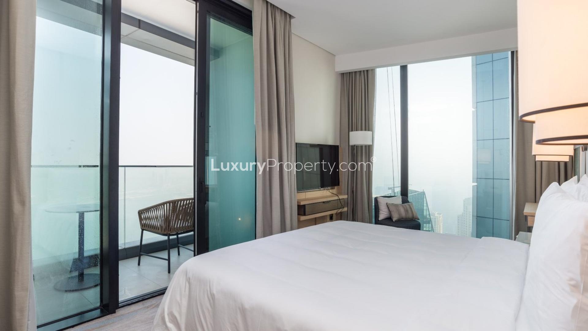 Modern bedroom with balcony view in Jumeirah Beach Residence apartment for rent